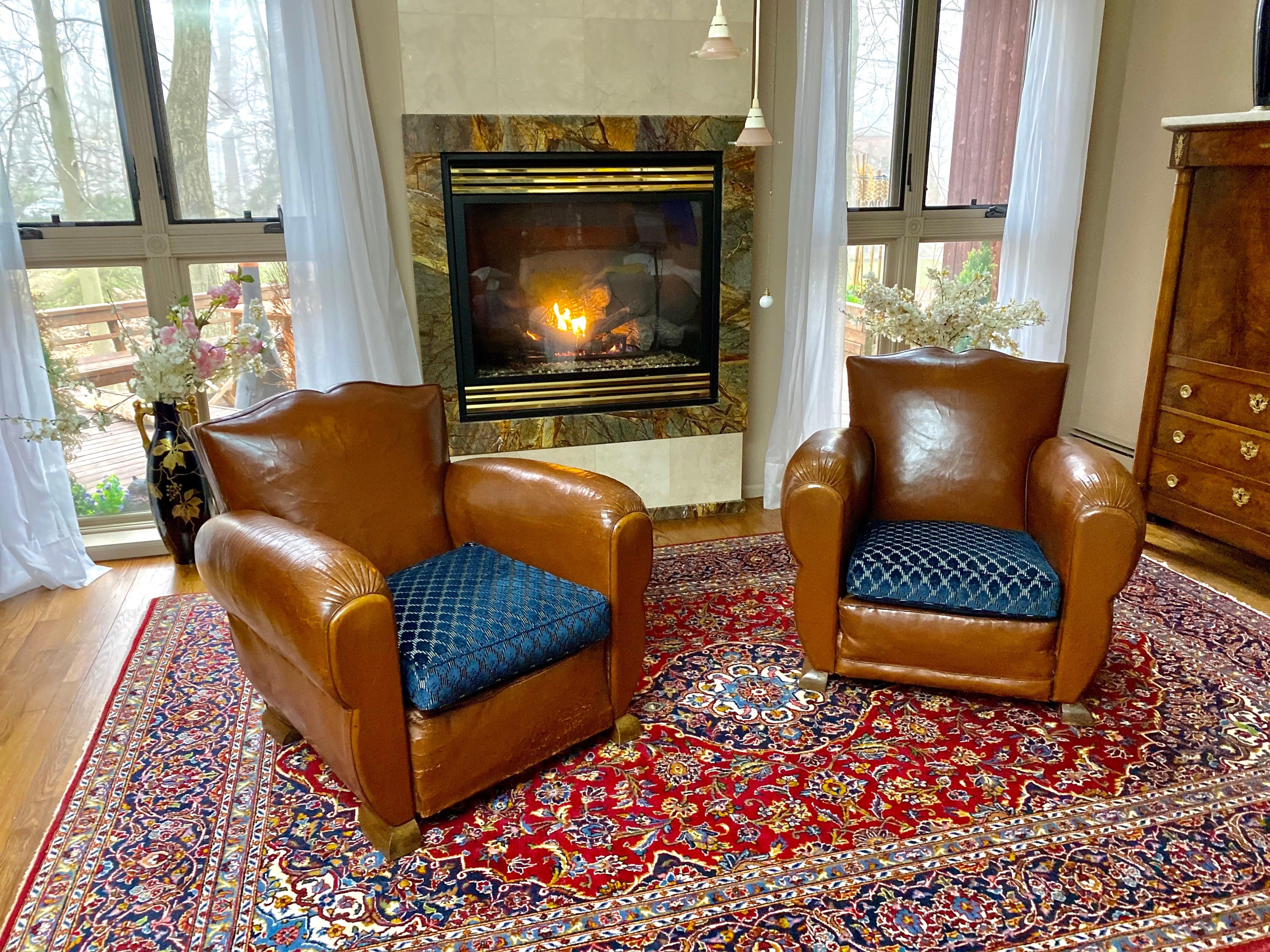 Pair of Moustache original Art Deco French leather club chairs. Circa 1930s with original leather. This is a beautiful, highly coveted Moustache clubs pair with a lot of character and charm. Extremely comfortable. In good general condition with wear