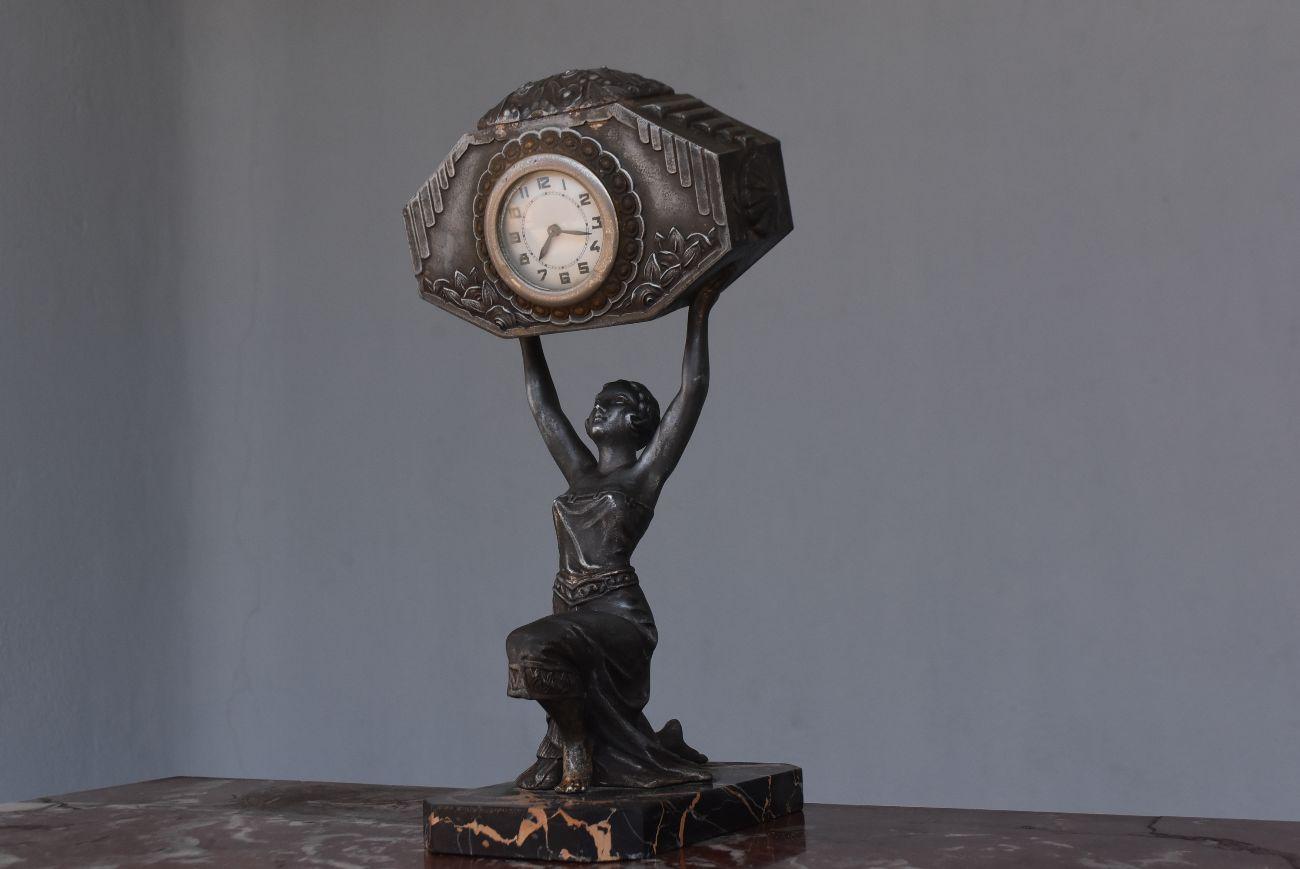 Art Deco 1930 pendulum dancer in regulates on marble base portor movement of the pendulum to be revised or repaired.