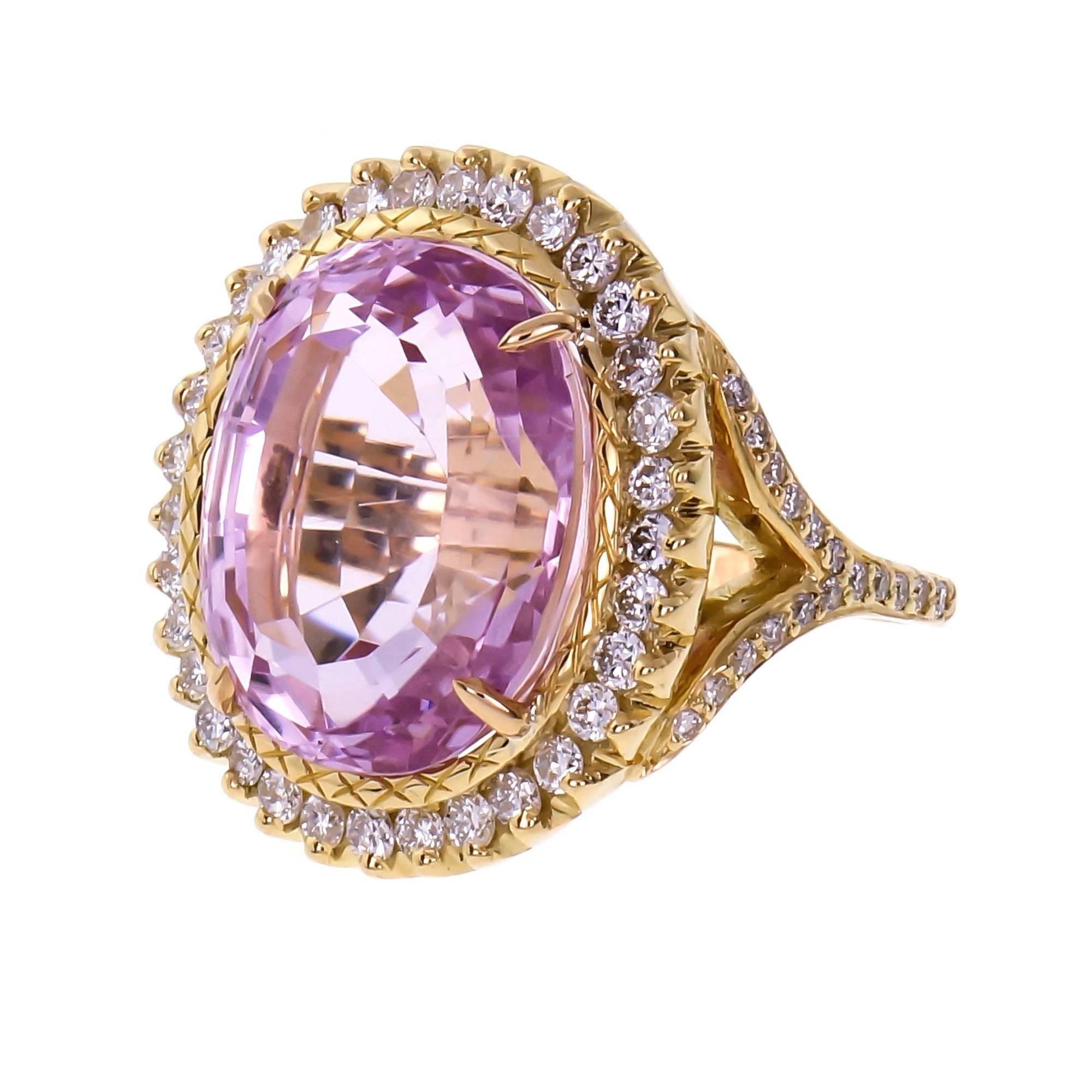 Bright pink oval Kunzite and diamond halo cocktail ring.  19.30cts oval step cut Kunzite in a custom made 18k yellow gold halo ring with a Diamond split shank. Sparkly round brilliant cut Diamonds. Hallmark we cannot make out. 

1 oval bright pink