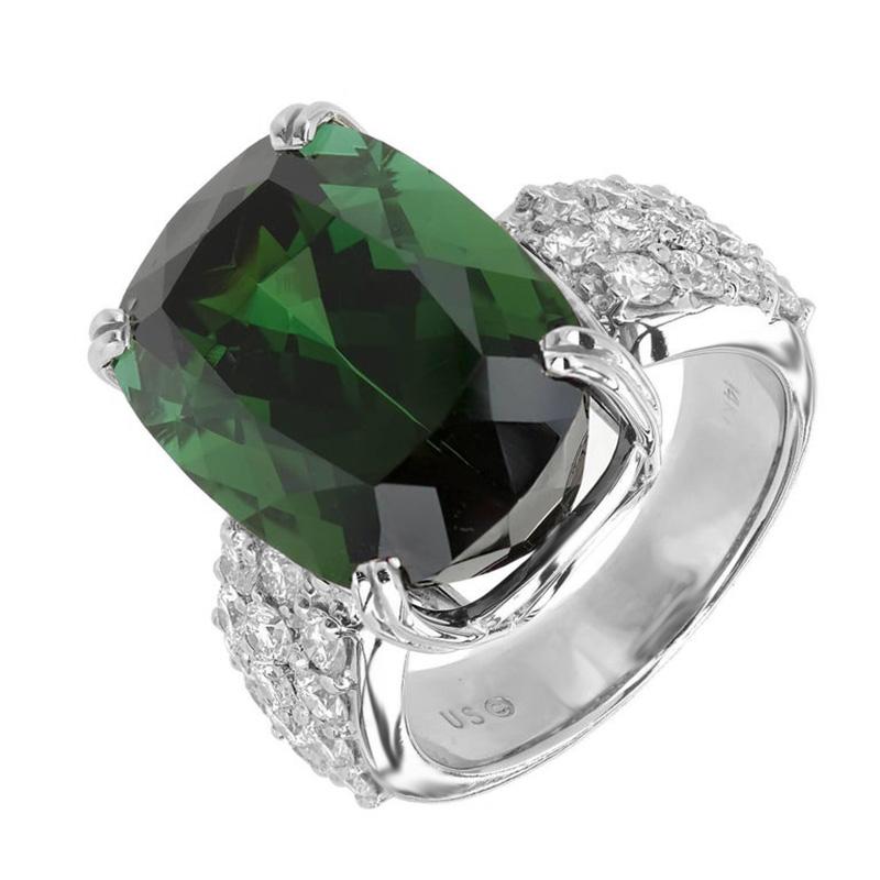 Vintage 1950-1960 Tourmaline and diamond cocktail ring. Substantial 19.30ct beautifully cut antique cushion shape green tourmaline center stone, mounted in a 14k white gold setting. Accented with three rows of 26 round brilliant cut diamonds along