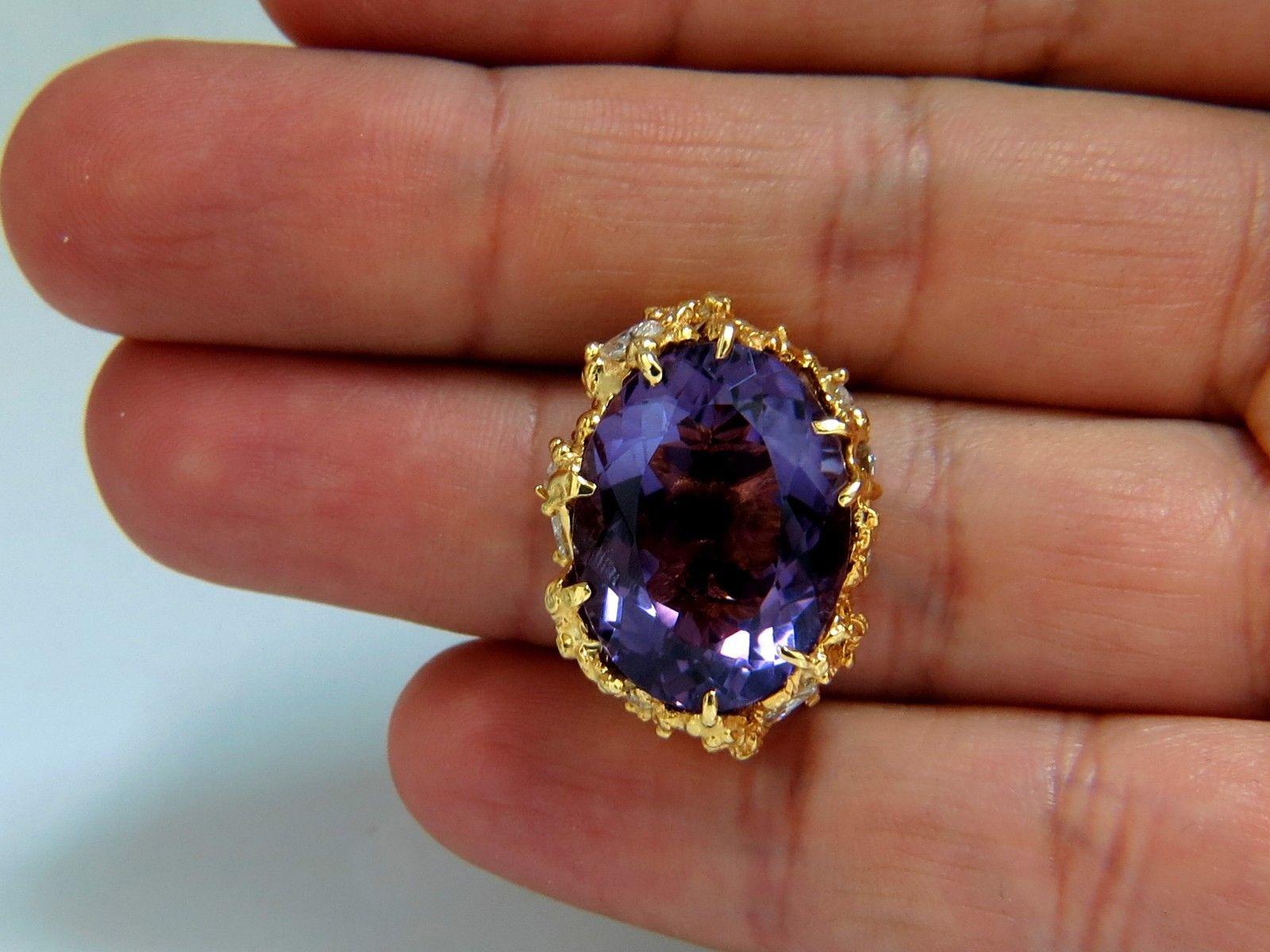 Purple Nugget Class

16ct. Natural Amethyst ring

Oval cut, Full cut Brilliant

20 X 15mm 

Clean Clarity & Transparent

The Prime Purple Velvet Color

3.30ct natural assorted cut diamonds.

Si-1 Si-2 clarity.

  14kt. yellow gold

13.7 Grams

Deck