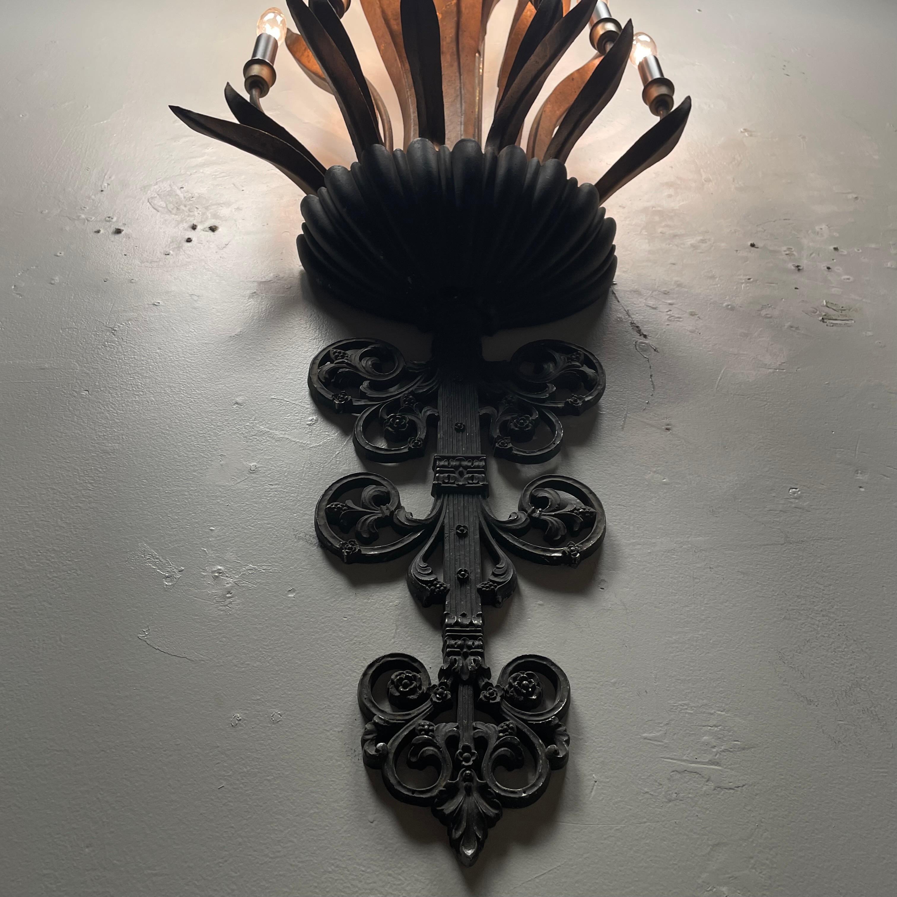 A very unique multi bulb large sconce light in metal .   Displaying wheat motif , makers mark old gilded finish with black accents .

Found in upper NY 


Syroco, short for Syracuse Ornamental Company, was known for creating decorative items and