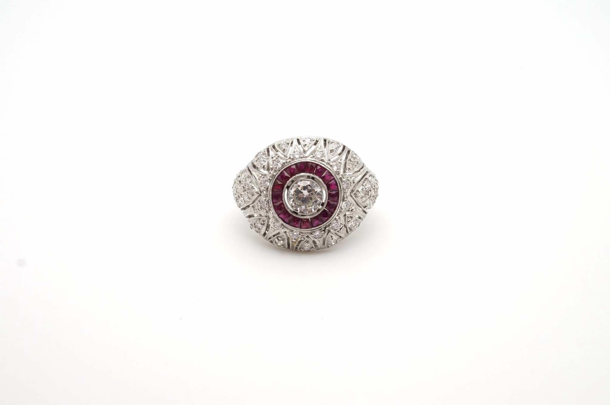 Stones: Diamonds for a total weight of 0.80 carat
and calibrated rubies.
Material: Platinum
Dimensions: 2cm length on finger x 2.5cm width
Period: 1930
Weight: 9.10g
Size: 53 (free sizing)
Certificate
Ref. : 24716