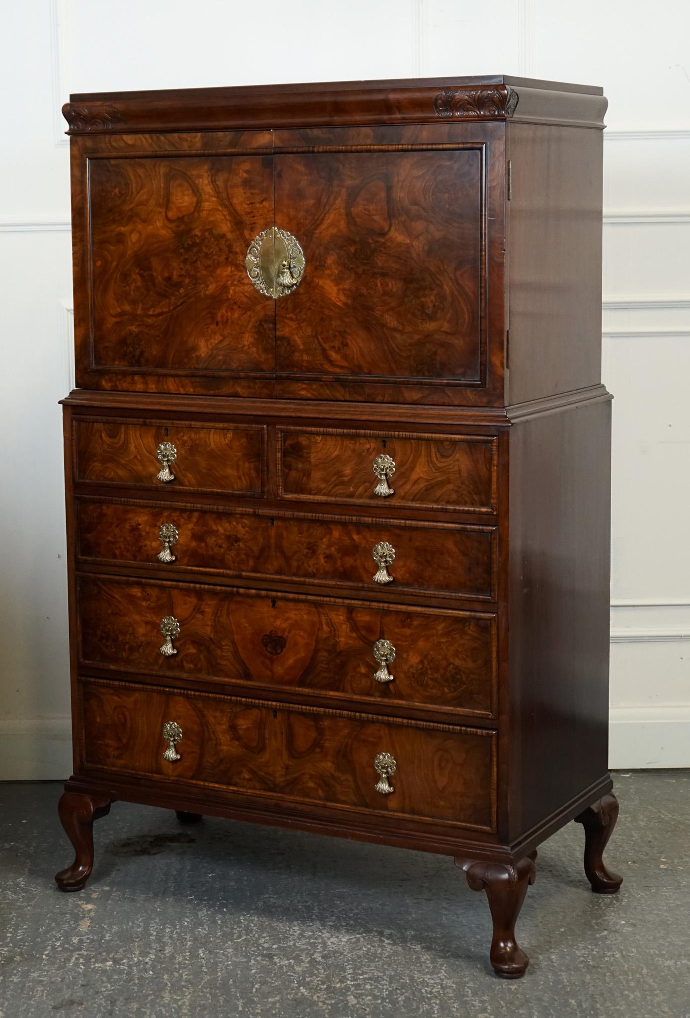 

We are delighted to offer for sale this Exquisite Tallboy Linen Press Chest of Drawers. 

Is crafted in the elegant English Queen Anne style, with a stunning walnut veneer that showcases intricate figure patterns. It was constructed during the
