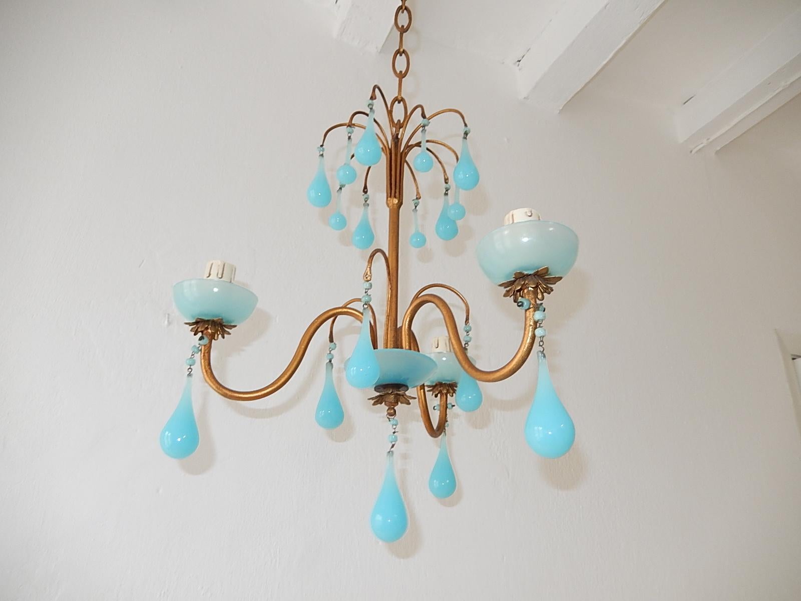 Housing 3-light sitting in blue opaline bobeches. Will be rewired with certified UL US sockets or appropriate sockets for other countries and ready to hang. Gilt metal. Murano blue opaline drops in two sizes and beads. Another blue bobeche on