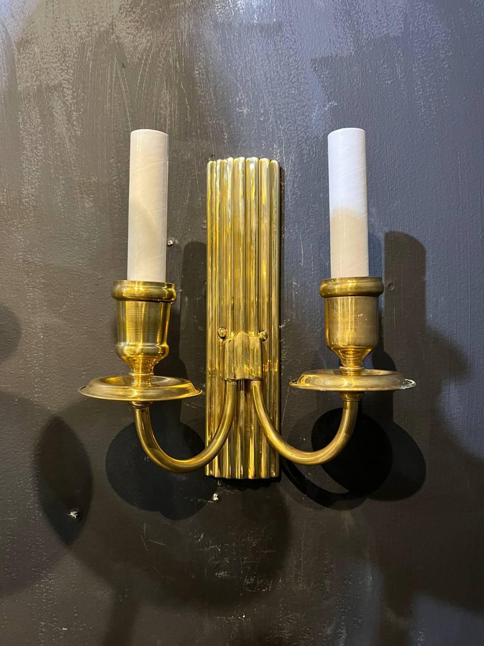 A pair of circa 1930's French gilt bronze sconces from Parisian Hotel 