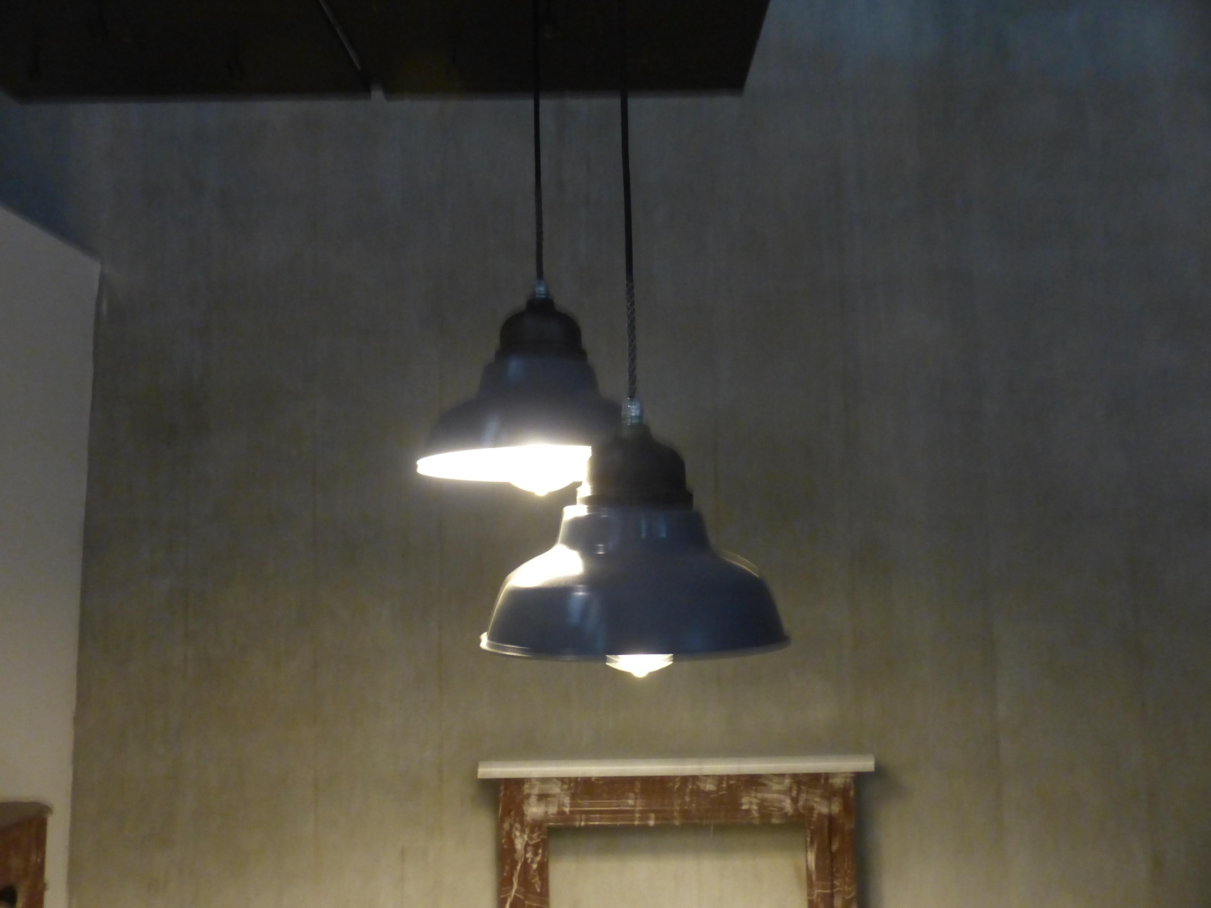 Set of two rewired Industrial pendants manufactured by Crouse hinds with glass globe, and soft grey painted finish on shade.
Csa approved and tested. 

Currently on 8 feet of cable, and complete with mounting cap for easy install.