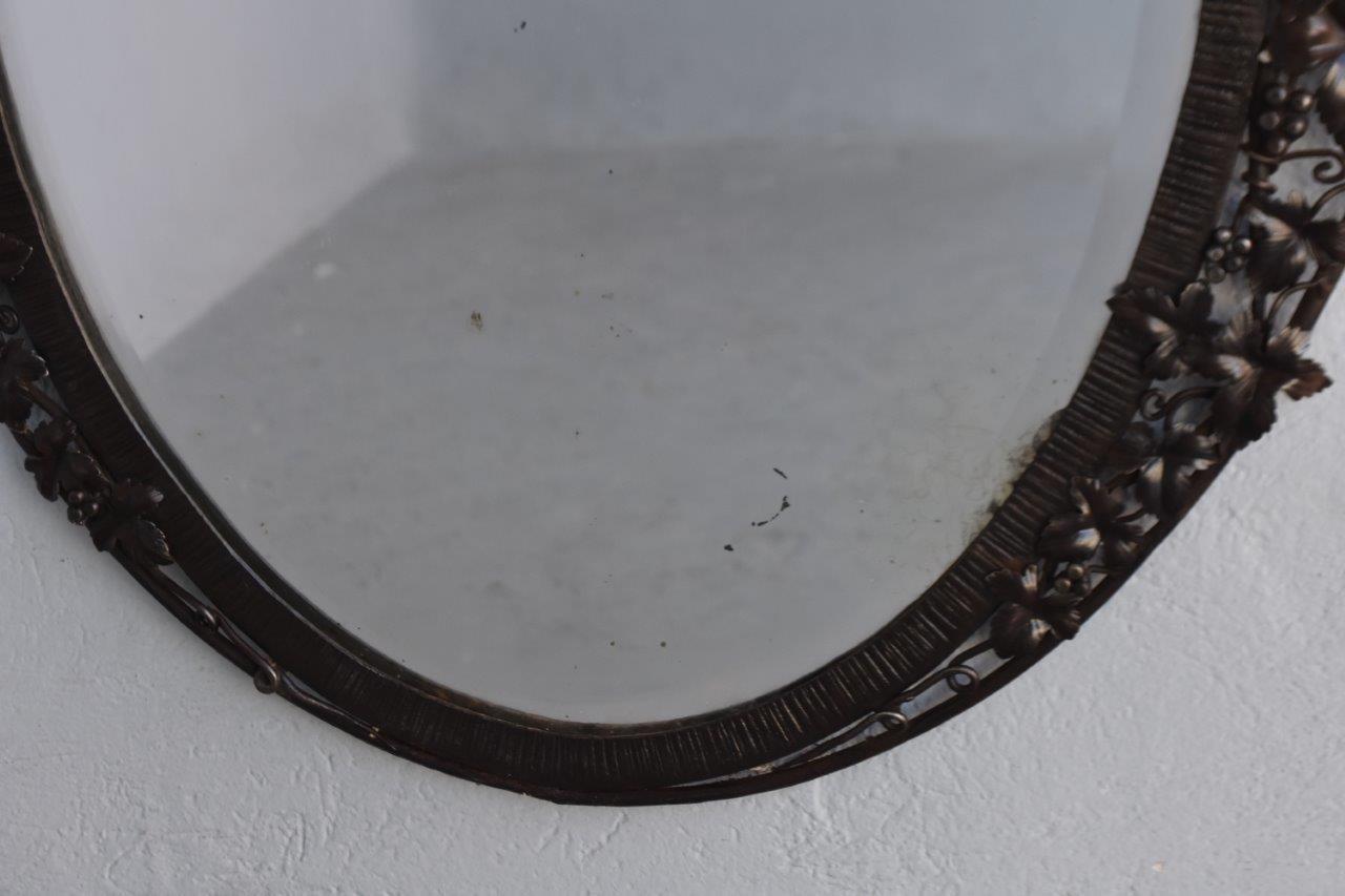 wrought iron oval mirror