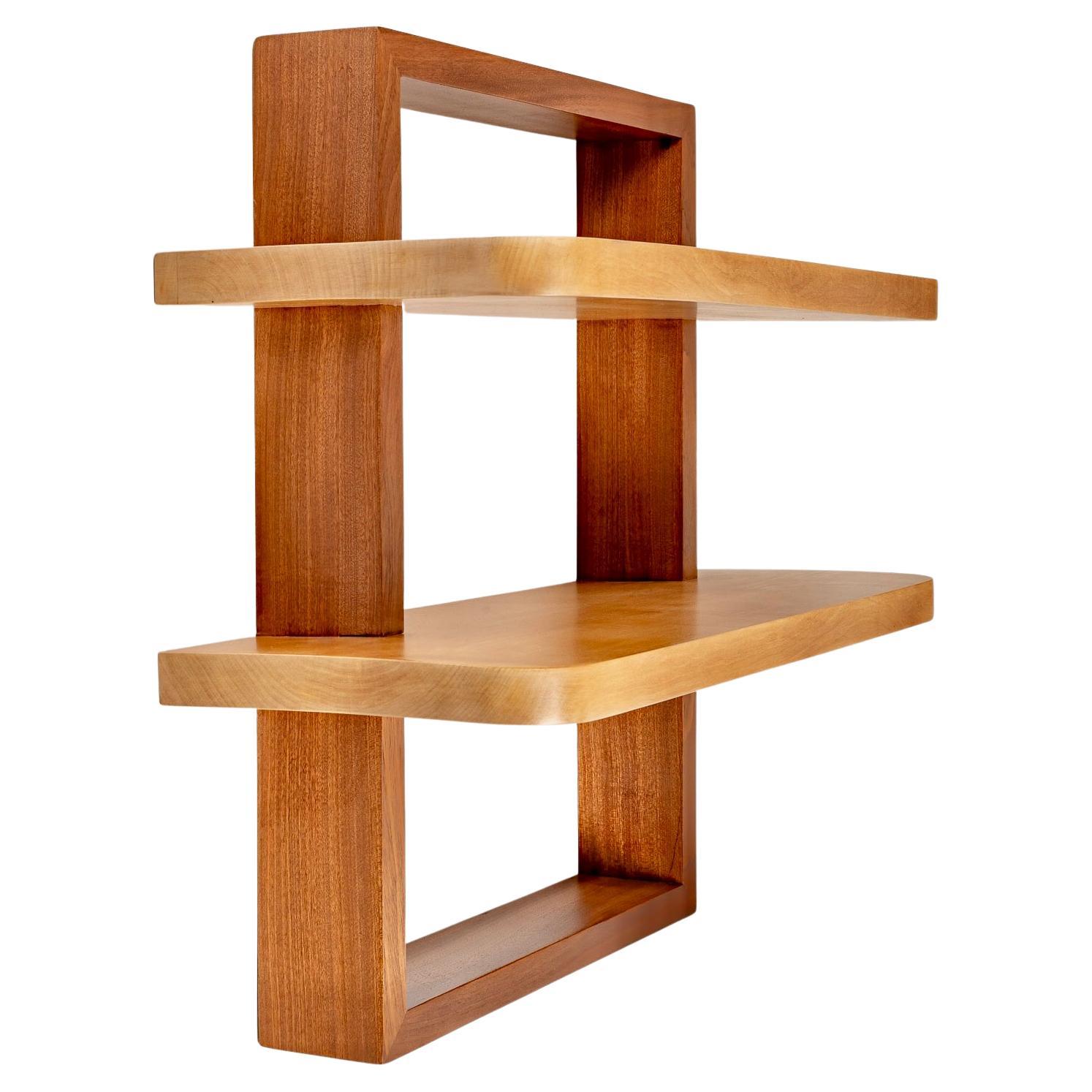 Typical work of the inspiration of the cubist period. 

Composed of a rectangular wall frame suspended in mahogany on which is inserted inside the frame two shelves in beech harmoniously distributed has two different heights in light beech