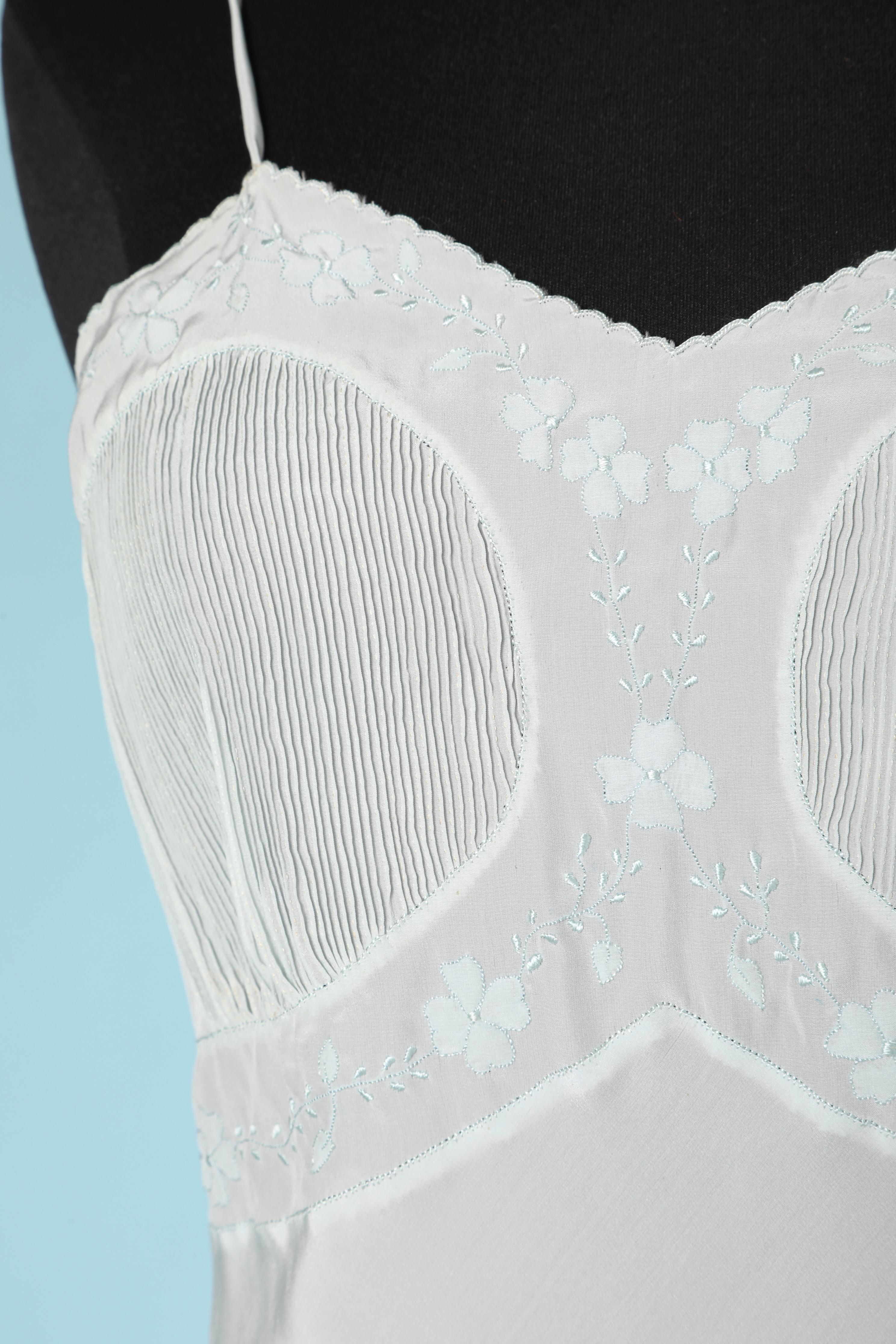  pale blue silk lingerie combinaison with appliqué and top-stitching on the bust. Cut in biais 