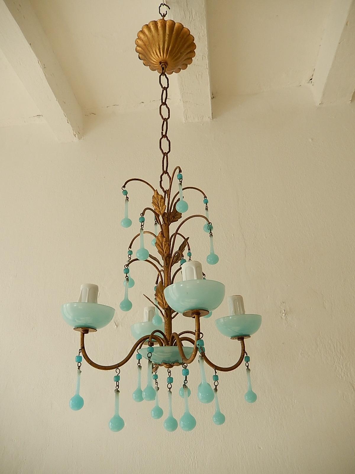 Housing 4-light sitting in blue opaline bobeches. Will be rewired with certified UL US sockets or appropriate sockets for other countries and ready to hang. Gilt metal. Murano blue opaline drops and beads. Another blue bobeche on bottom. Adding
