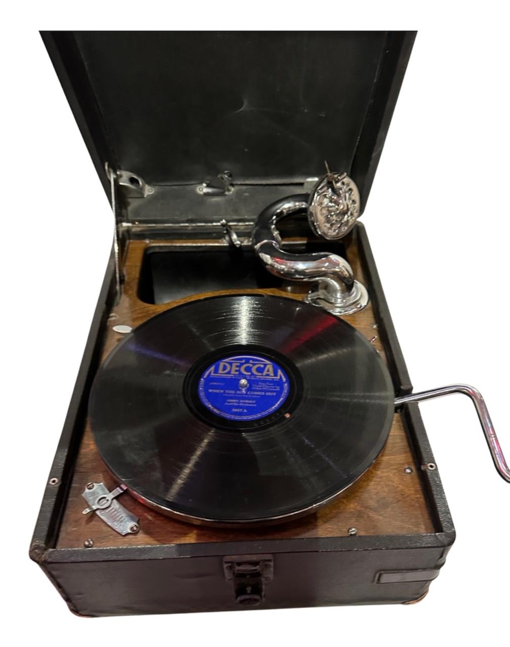 1930 Portable Gramophone his master’s voice original covered finish. This 1930 Portable Gramophone is the real deal. It’s an HMV Model 101, part of a small collection of such classic sound machines which have been restored. The outside and inside