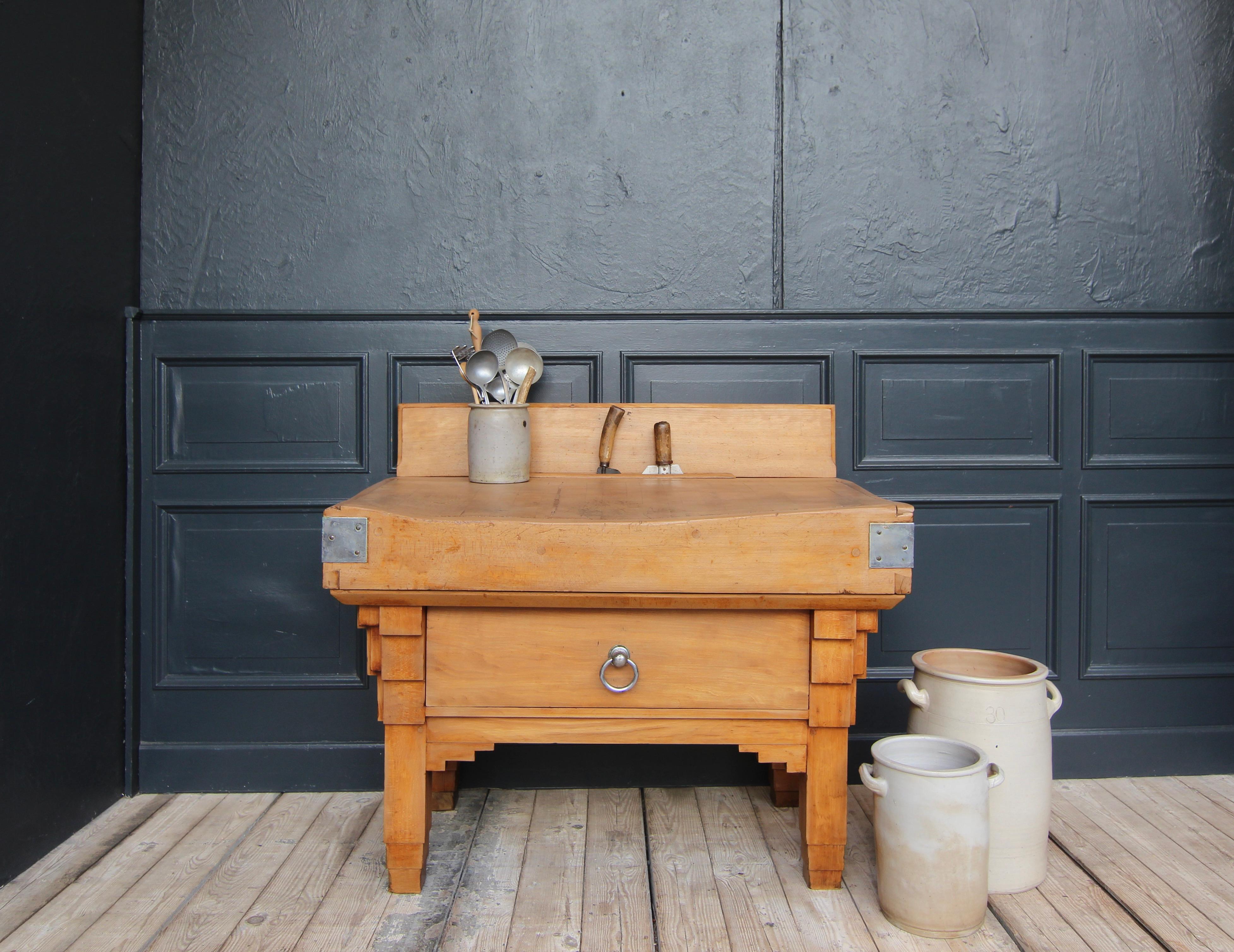 A 1930´s butcher's block in Art Deco style. Made of solid beech wood. 

Since the Middle Ages, the profession of butcher has been one of the most respected and lucrative occupations. Even back then, the first butcher's blocks were made with a top