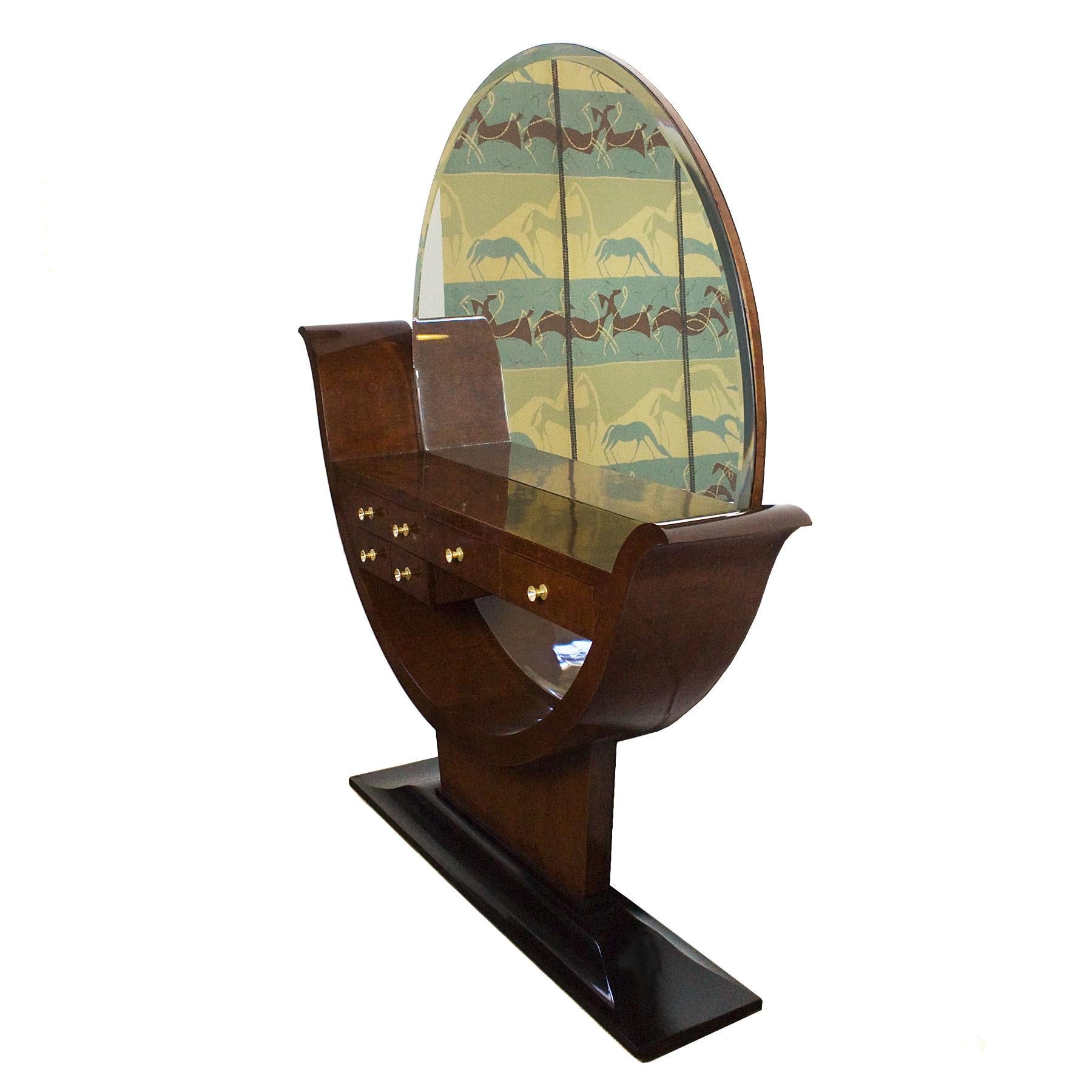 Rare Art Deco entrance hall console with six drawers, solid wood with mottled mahogany veneer, French polish. Black lacquered solid walnut base. Original round beveled mirror. Polished brass handles.

Spain, Barcelona, circa 1930.