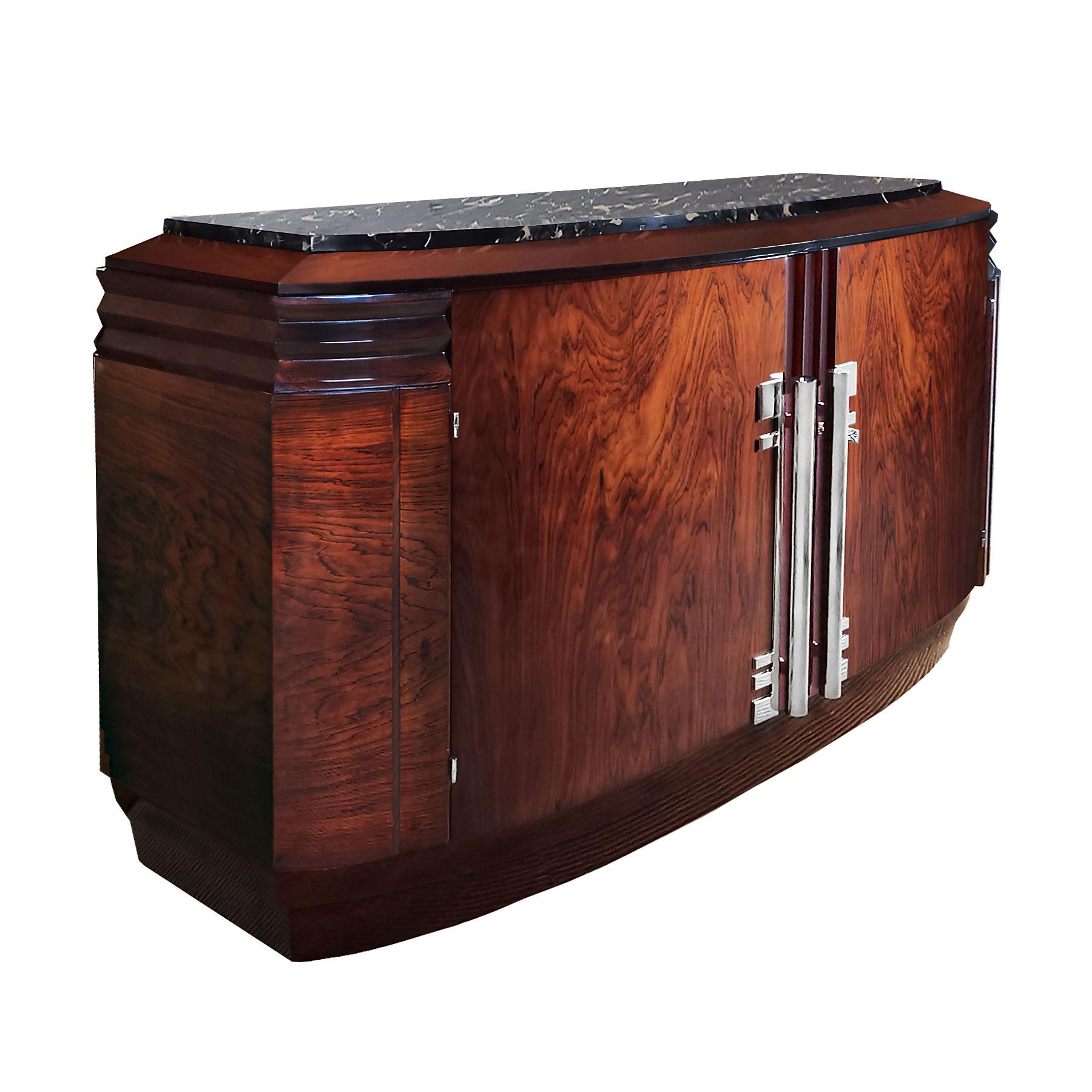 Art Deco sideboard with two doors, solids mahogany and oak structure, mahogany veneer, French polish. Nickel plated solid brass handles and hardware. Portor marble on top. Sycamore and mahogany inside with three drawers and shelf.
The top marble is