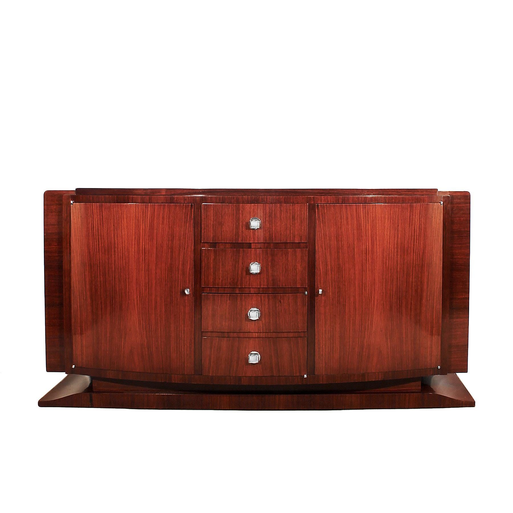 Art Deco sideboard, solid mahogany and mahogany veneer, French polish, two drawers and a false drawers door at the bottom, two side doors with shelves, nickel-plated bronze hardware,

France, circa 1930.