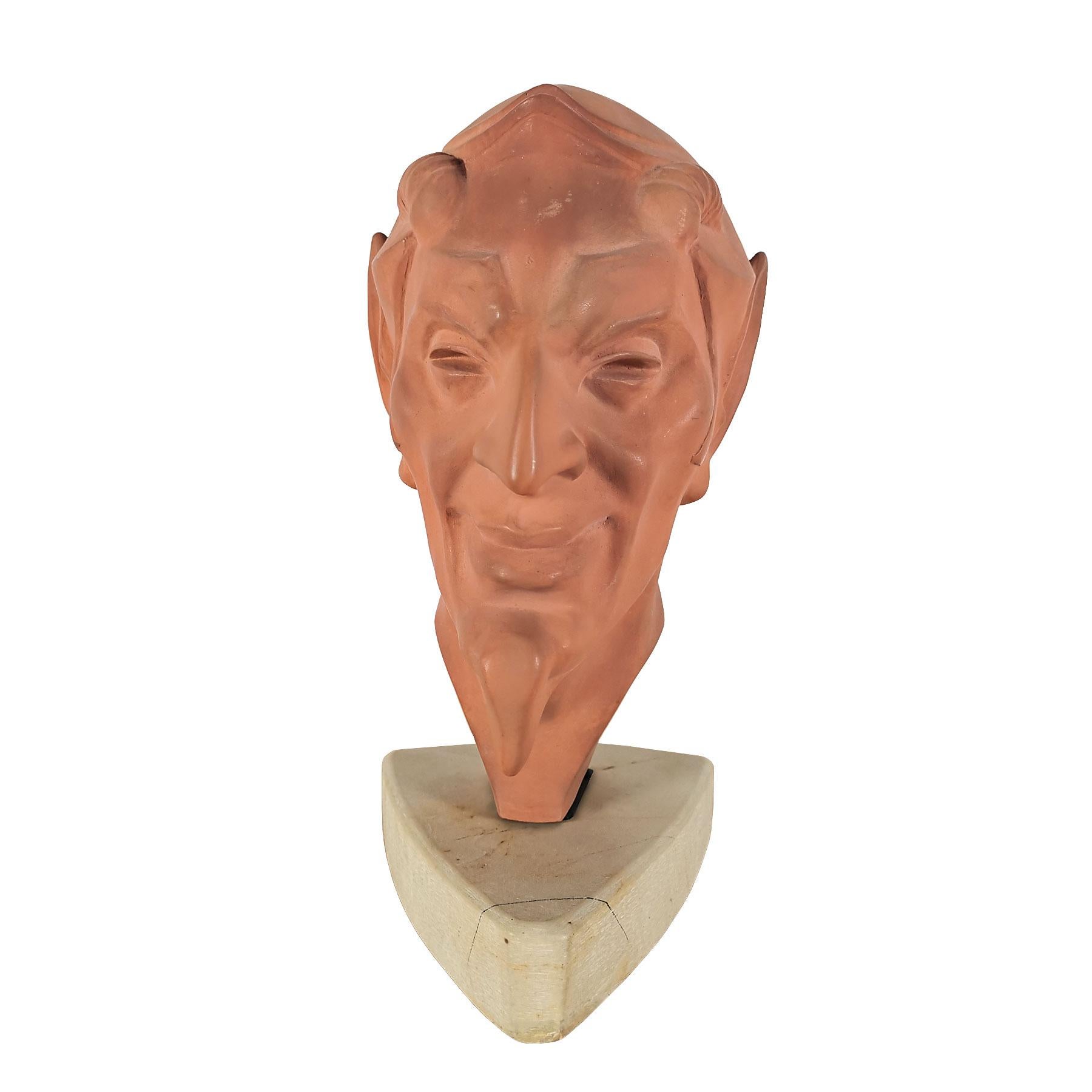 Art Deco stylized faun's head in terracotta with a marble base. Nice craftsmanship.
Signed: Le Vierrier

France, circa 1930.