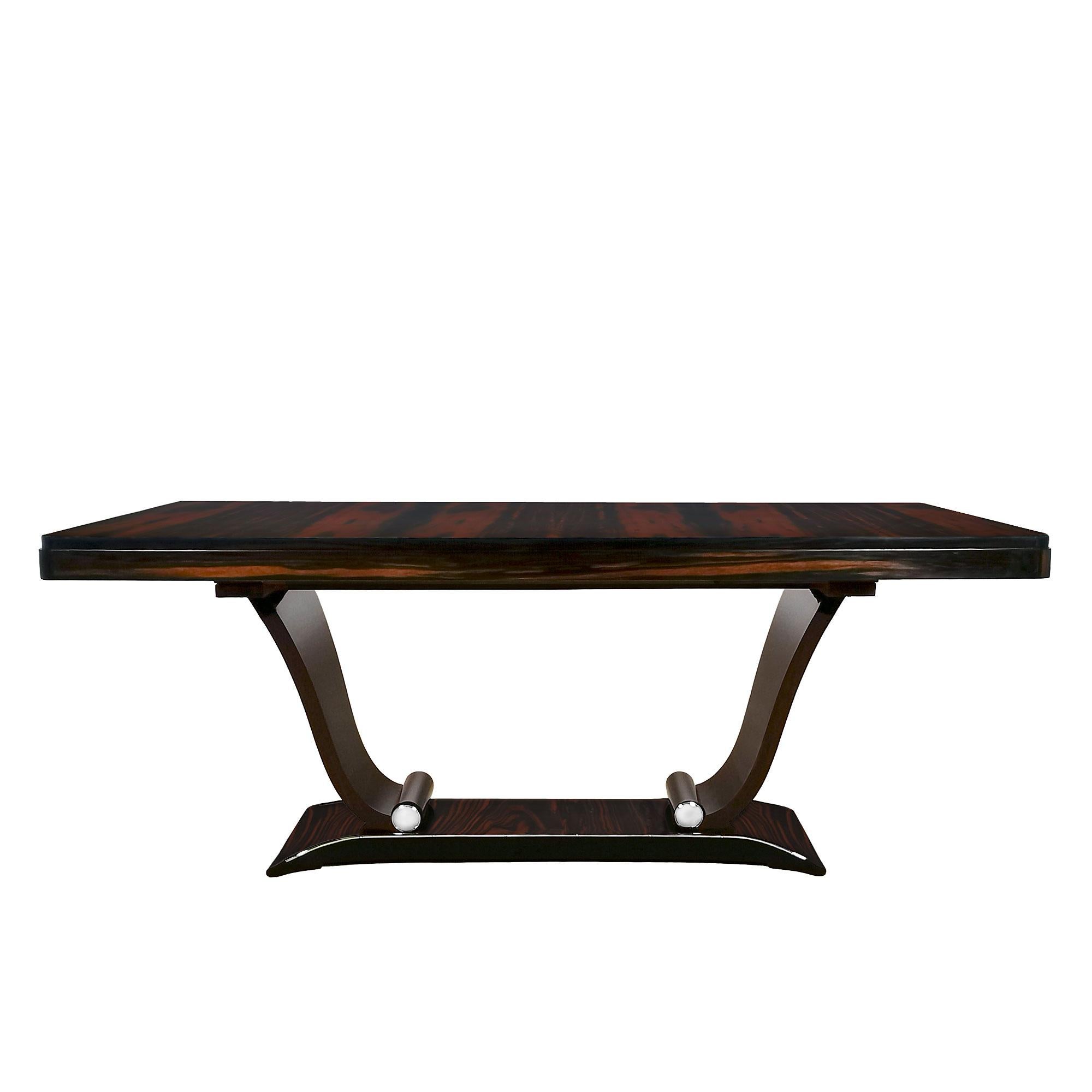 Art Deco dining table, solid wood with Macassar ebony veneer, dark brown lacquered base, extension leaf system, working as drawers with two originals leaves with Macassar ebony veneer, french polish. Nickel plated brass decoration on base.
Brand: