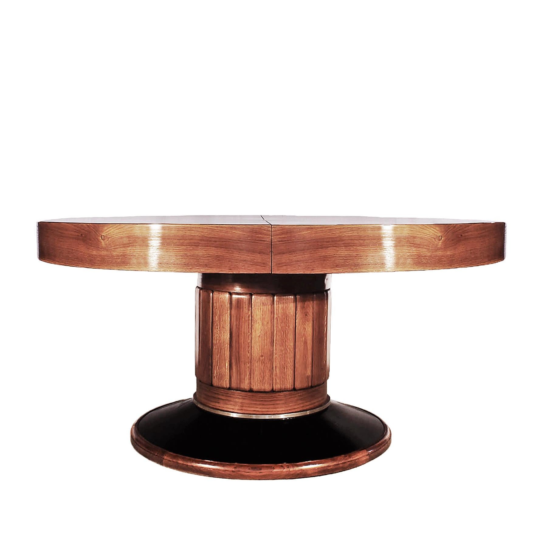 Big Art Deco round table, solid oak with oak veneer marquetry, moulding oak stand with a black stained oak veneer base with a nickel plated brass ring, French polish. Possibility of making leaves up to 120 cm wide, by request.

Spain, Barcelona,
