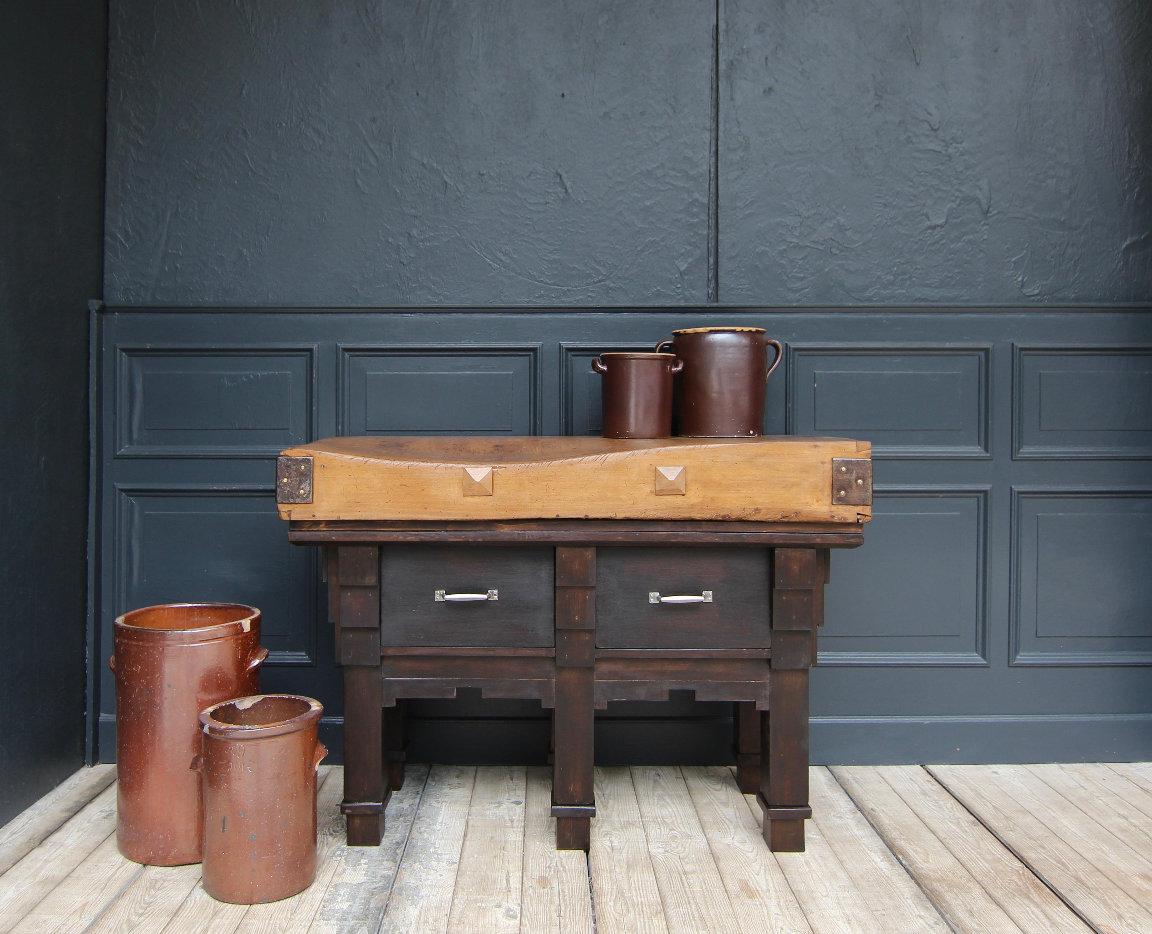 Vintage butcher's block table in Art Deco style from the 1930s. Made of solid beech wood. 

Base with square legs and high frame with 2 large drawers. The solid worktop lies on top.

Since the Middle Ages, the profession of butcher has been one of