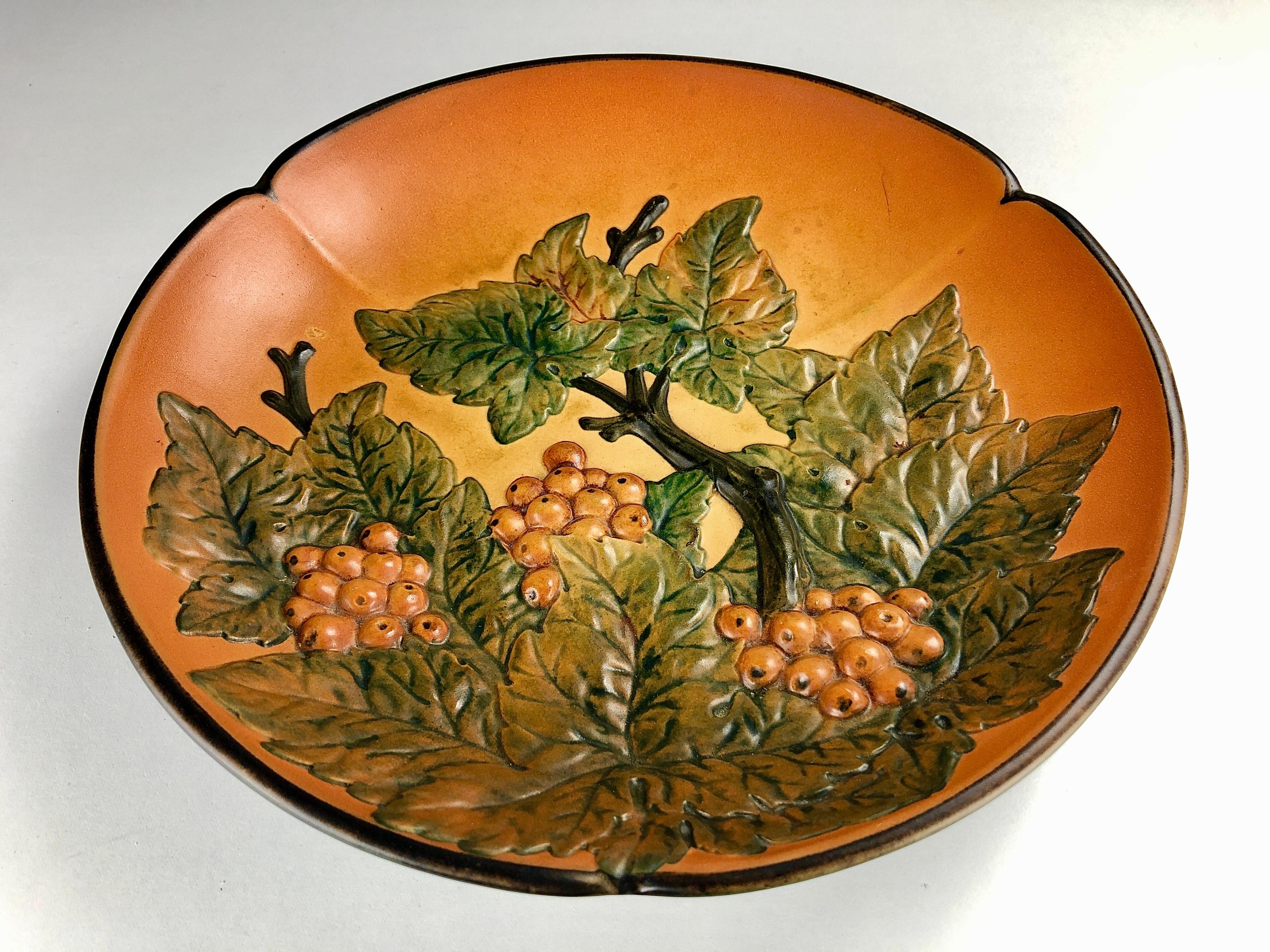 Danish decorative platter by Axel Sørensen for P. Ipsens Enke 1939

The platter feature a branch of lively colorfull rowanberries is in very good vintage condition.

Ipsens Enke (1843 - 1955) was a very succesfull company that especially during the