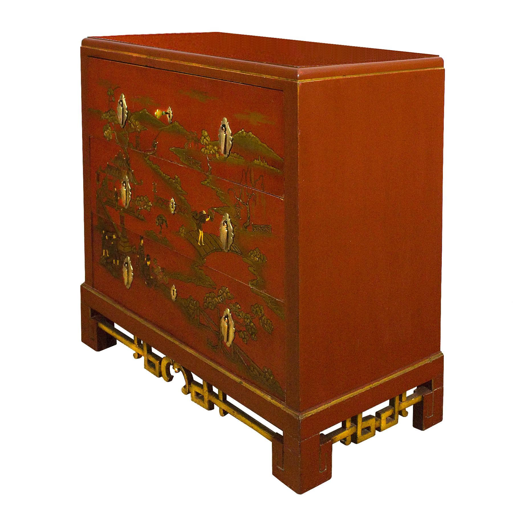 Japanese inspired chest of drawers-secrétaire, red lacquered solid wood with scenes in golden decoration and relief paints. Top drawer opens to a secretary with lemon wood and walnut burr, other drawers with bird's-eye maple inside. Polished solid