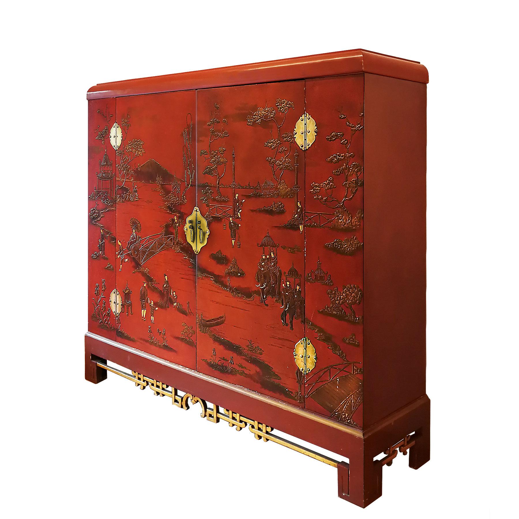 Large wardrobe, solid red lacquered wood with chinoiserie relief stucco and partially with golden leaf. Bird's-eye maple veneer inside and brass hardware. Can be completely dismantled. Original condition.
France, circa 1930.