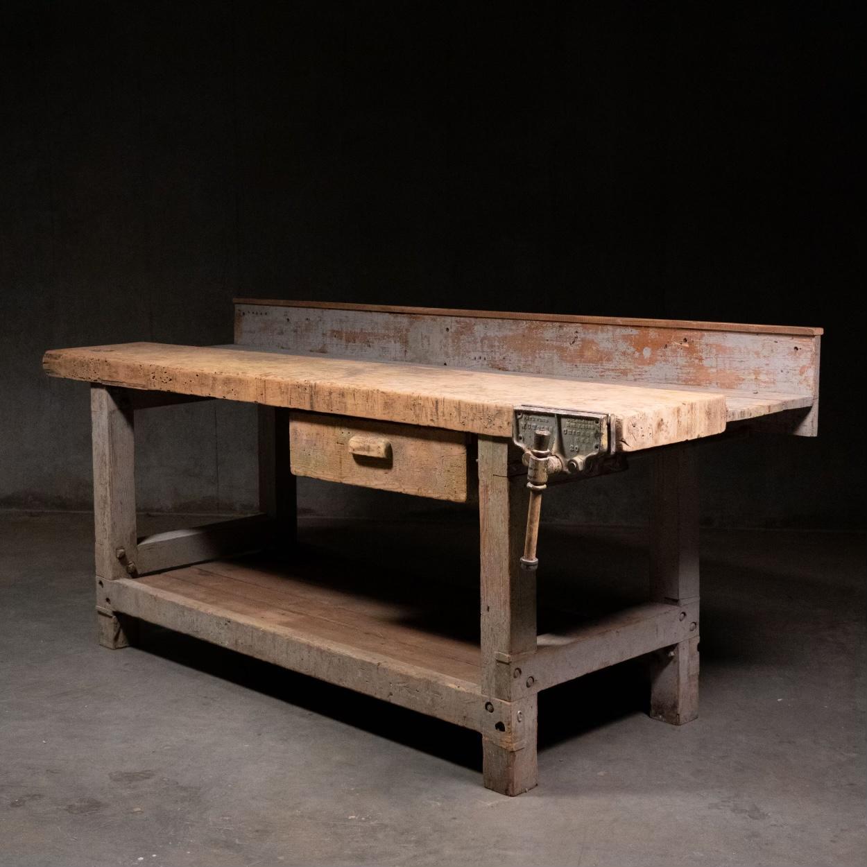 A very nice solid work bench in old worn painted grey finish. This piece was found in a factory outside Seattle. 
Restoration free this is a solid beautiful piece.