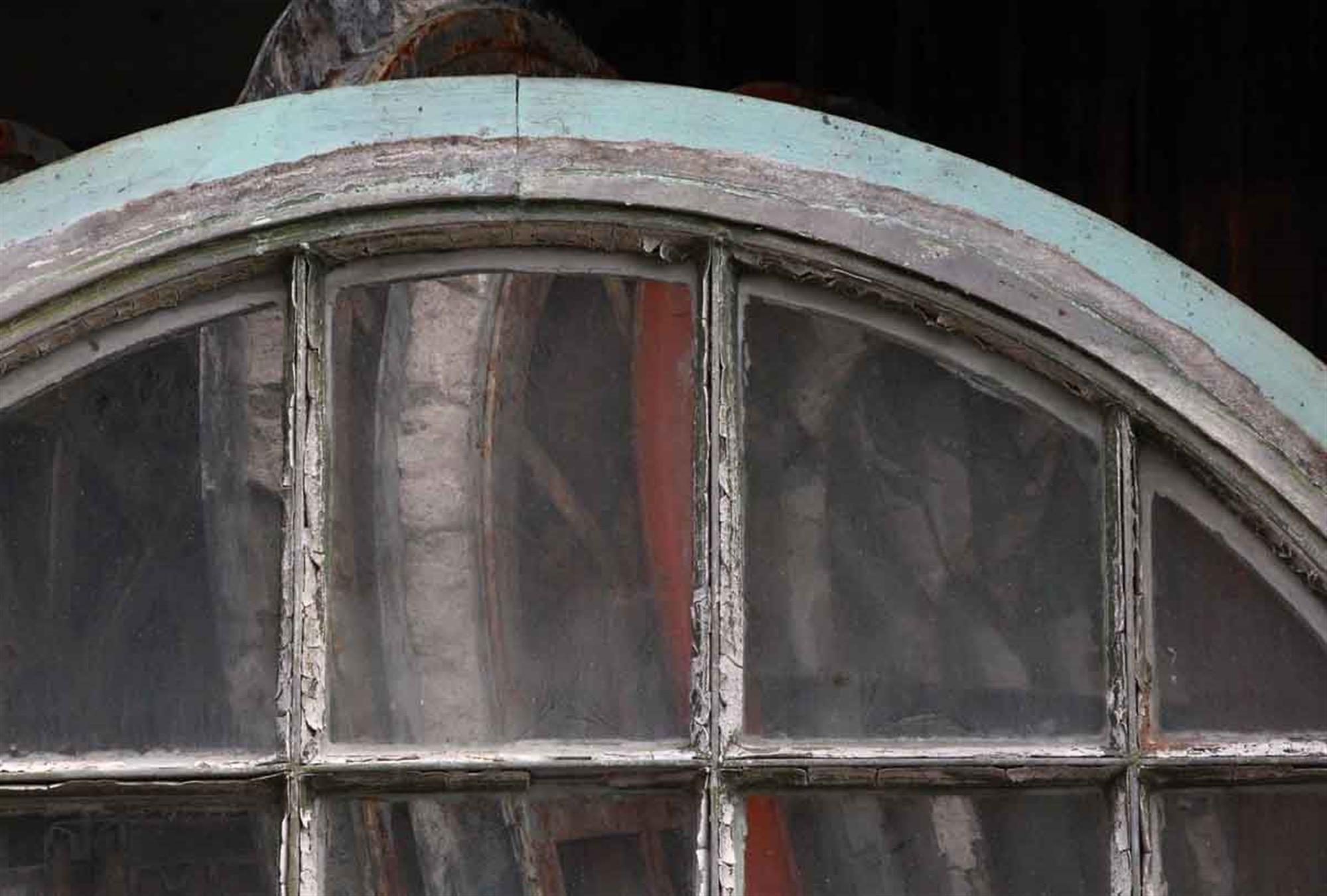 1930 steel palladian window from New Jersey. They have the unique feature of four opening horizontal windows. The original arched frame is included in the price, as well as the original window hardware. Most have been painted green. Windows may need