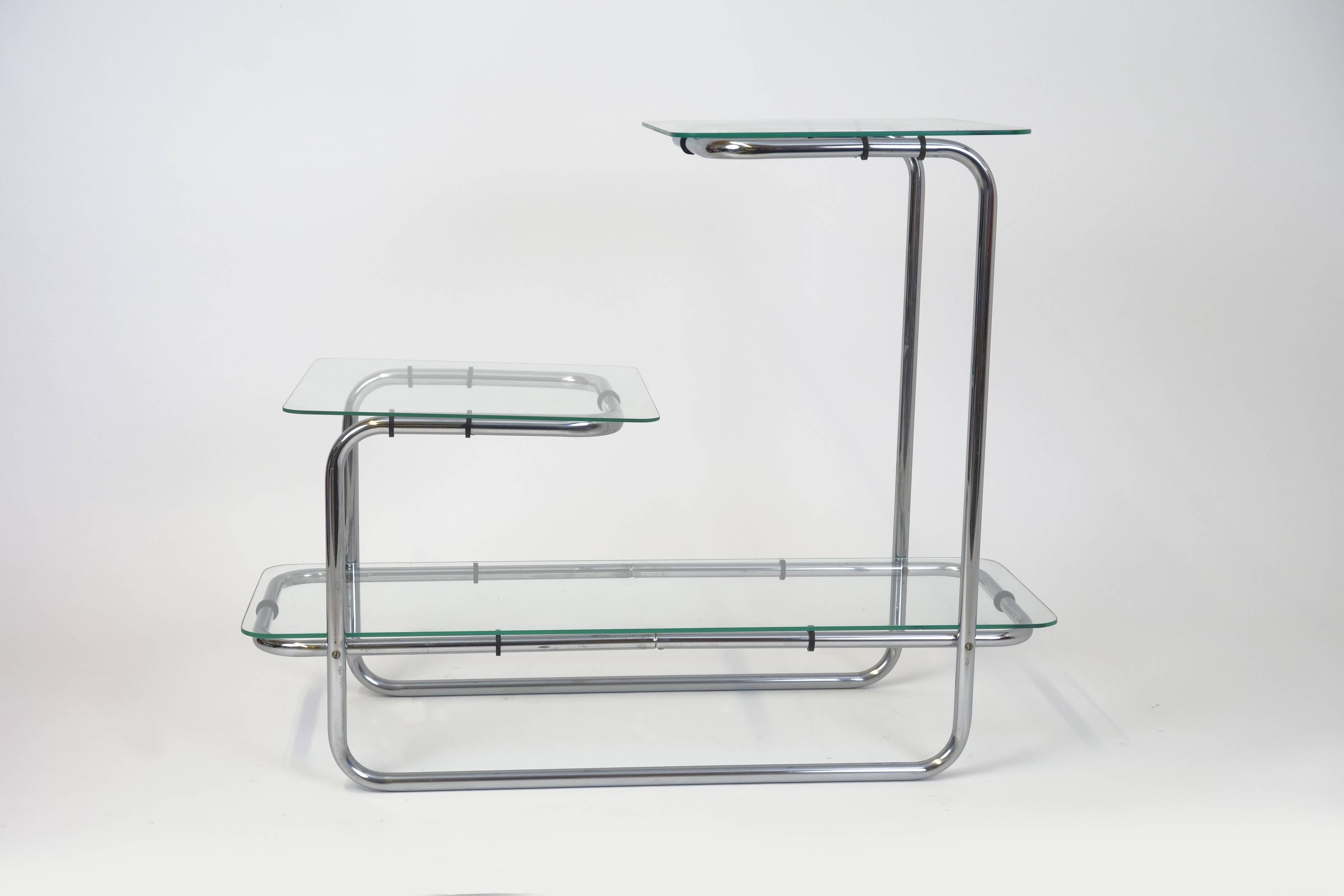 The fine and subtle flower shelf B 136 by Emile Guyot for Thonet, made in the 1930s. This functional tubular steel shelf, designed in the Bauhaus style, has 3 levels and, not only be suitable for flowers, will find place even in well-furnished