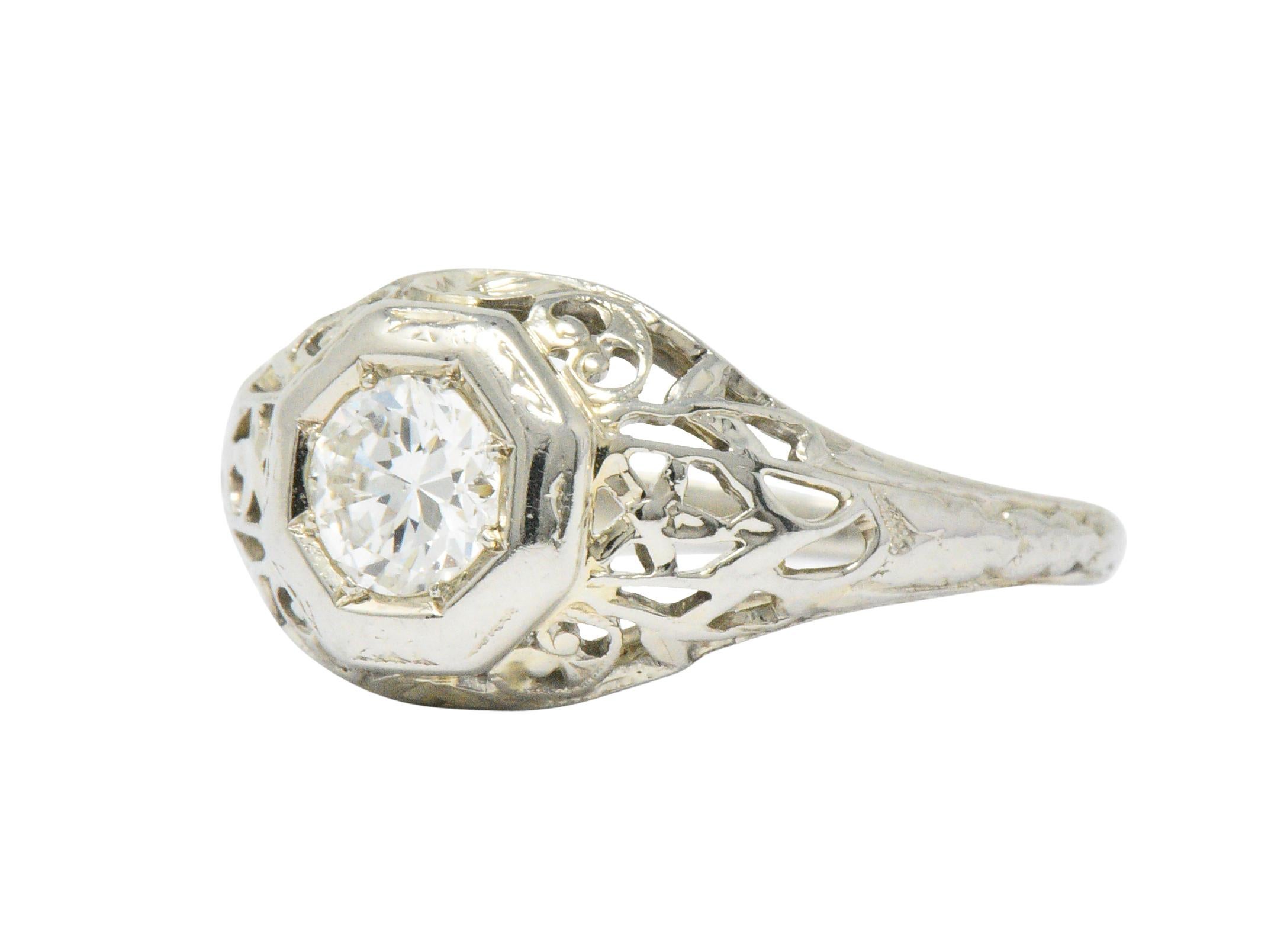 Centering an old European cut diamond weighing approximately 0.33 carats, H color and VS clarity

Hexagonal head with pierced filigree mount

Ring Size: 5 1/4 & Sizable

Top measures 9.0 mm and sits 4.5 mm high

Total Weight: 2.1 Grams

Pretty.