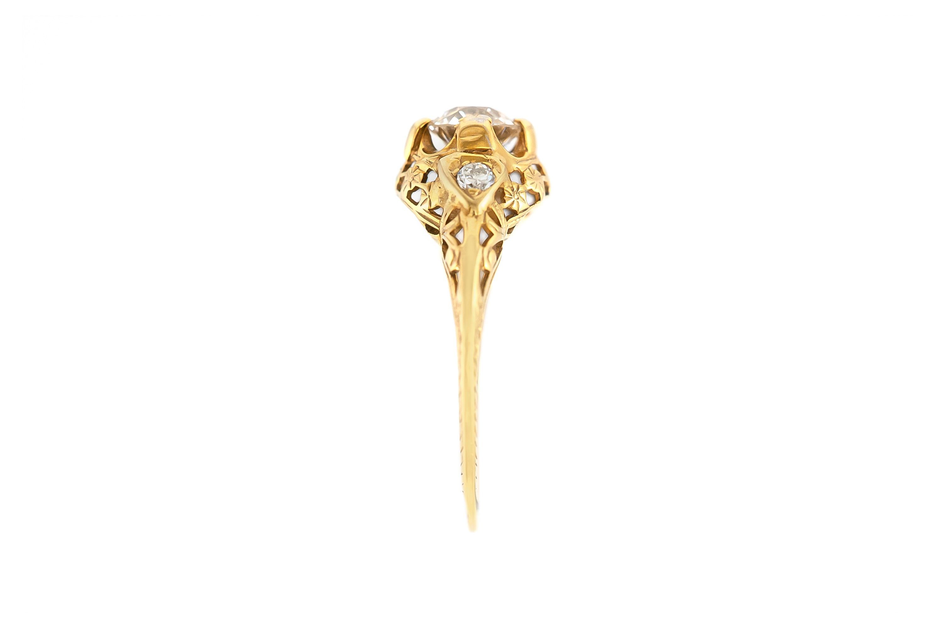 The beautiful ring is finely crafted in 14k yellow gold with center diamond weighing approximately total of 0.80 carat and 0.10 carat of two side round diamond .
Circa 1930.
Easy to resize