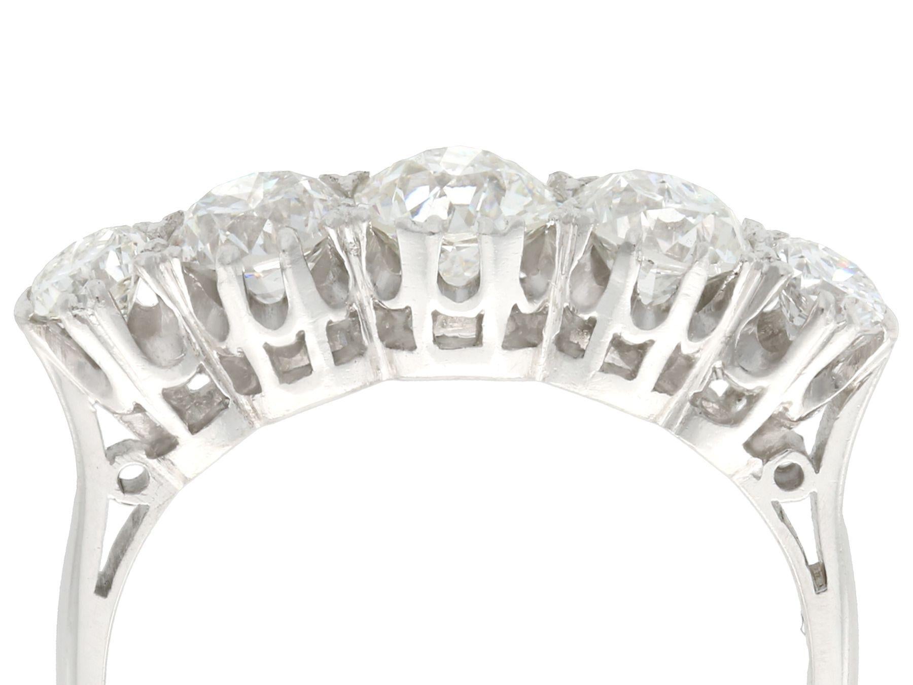 A stunning antique 1930s 1.67 carat diamond and 18 karat white gold, platinum set five stone dress ring; part of our diverse antique estate jewelry collections.

This stunning, fine and impressive five stone diamond ring has been crafted in 18k