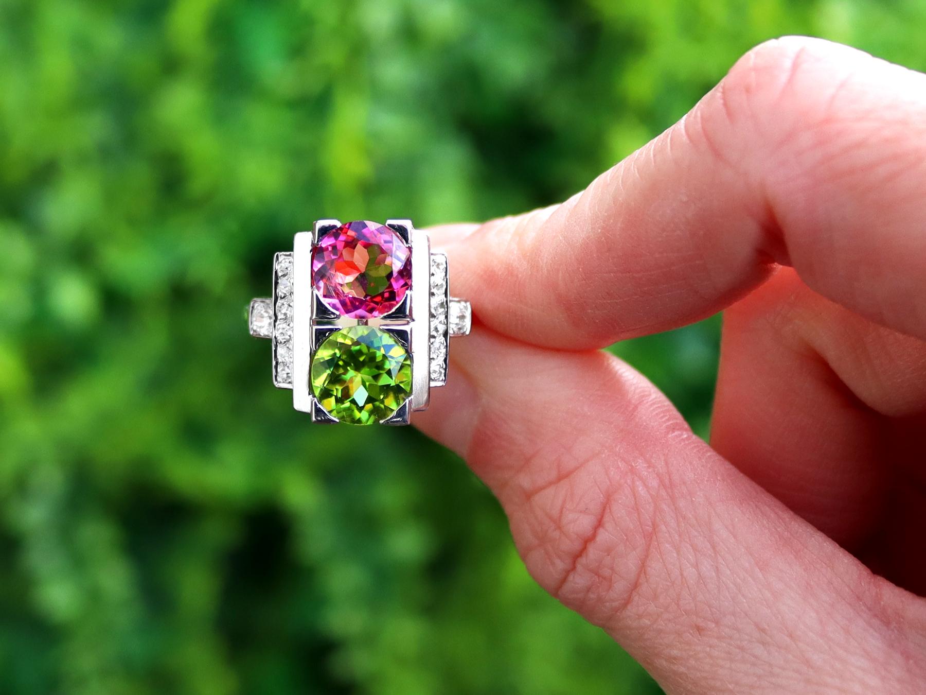 A stunning, fine and impressive 1.76 carat pink tourmaline, 1.70 carat peridot and 0.34 carat diamond platinum Art Deco dress ring; part of our antique dress rings collection.

The pierced, decorated setting is ornamented with an impressive feature