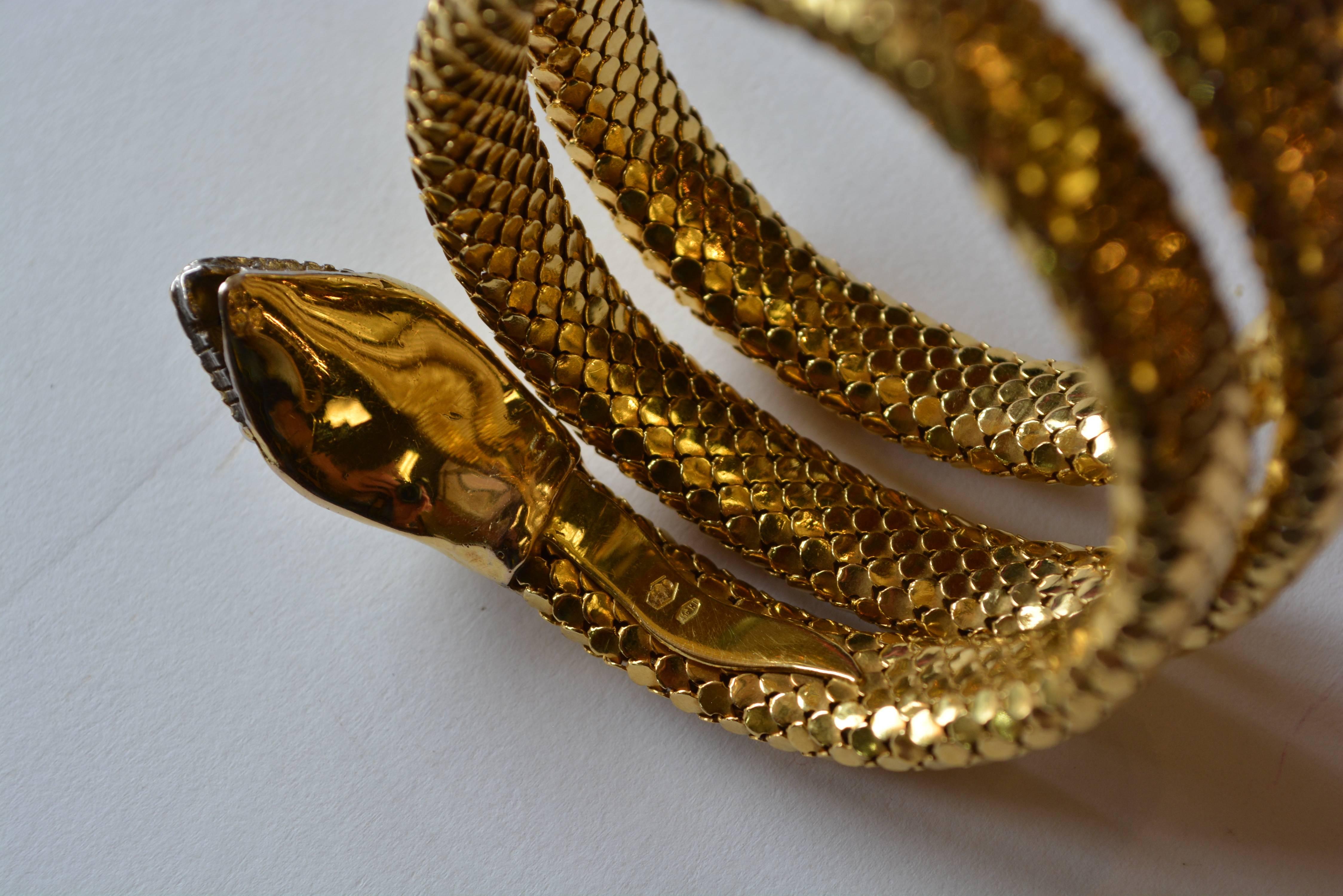 Art Deco 18K gold and emerald mesh wrap snake bracelet, circa 1930s. Marked but hard to decipher. Fits a 6 to 7