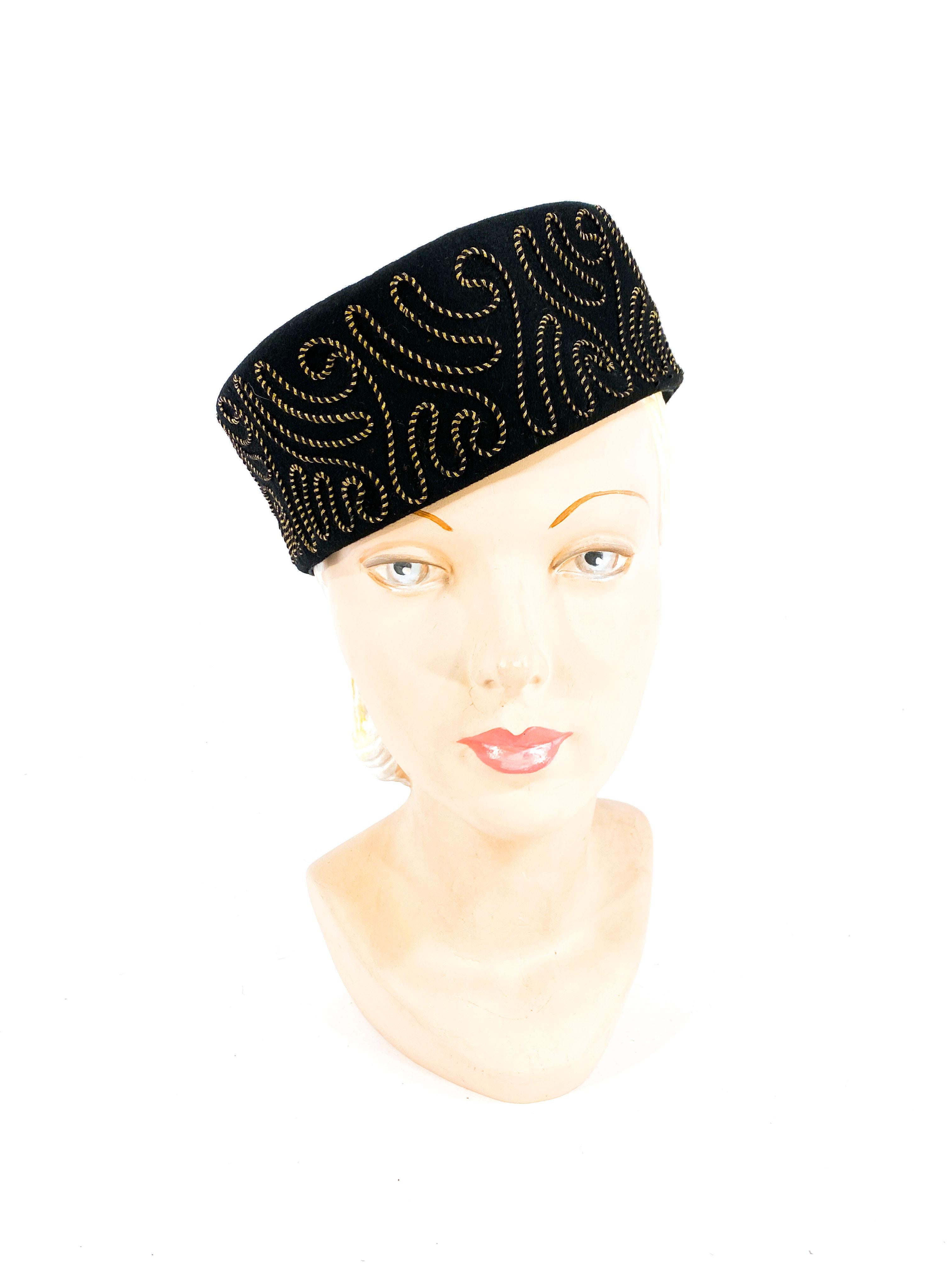 Late 1930s to early 1940s black sculpted wool felt cossack/perch hat featuring a silk and gold metallic sous-tâche embroidery. Avant-garde design with detailing on two-thirds of the entire brim.