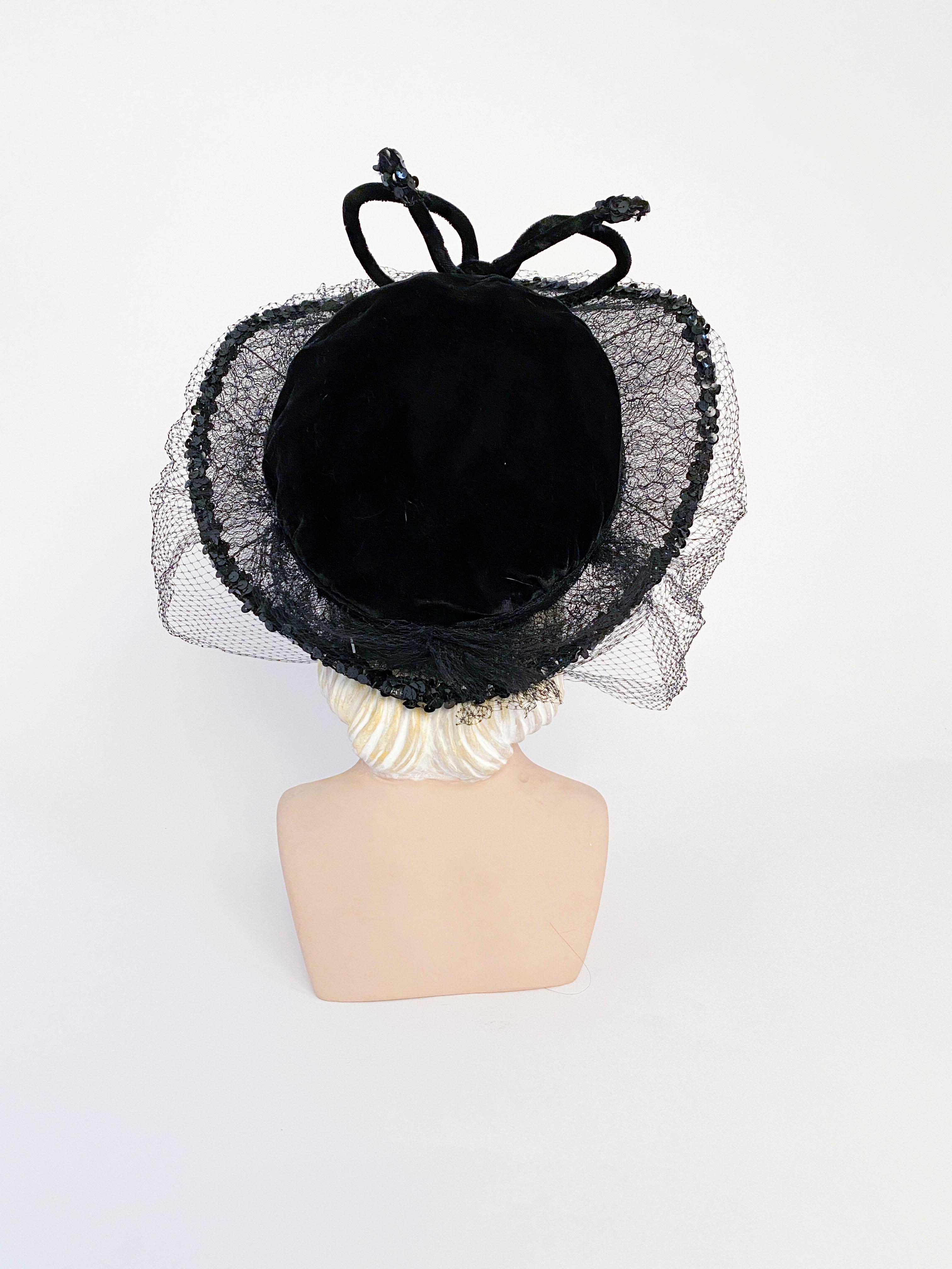 hat with lace over face