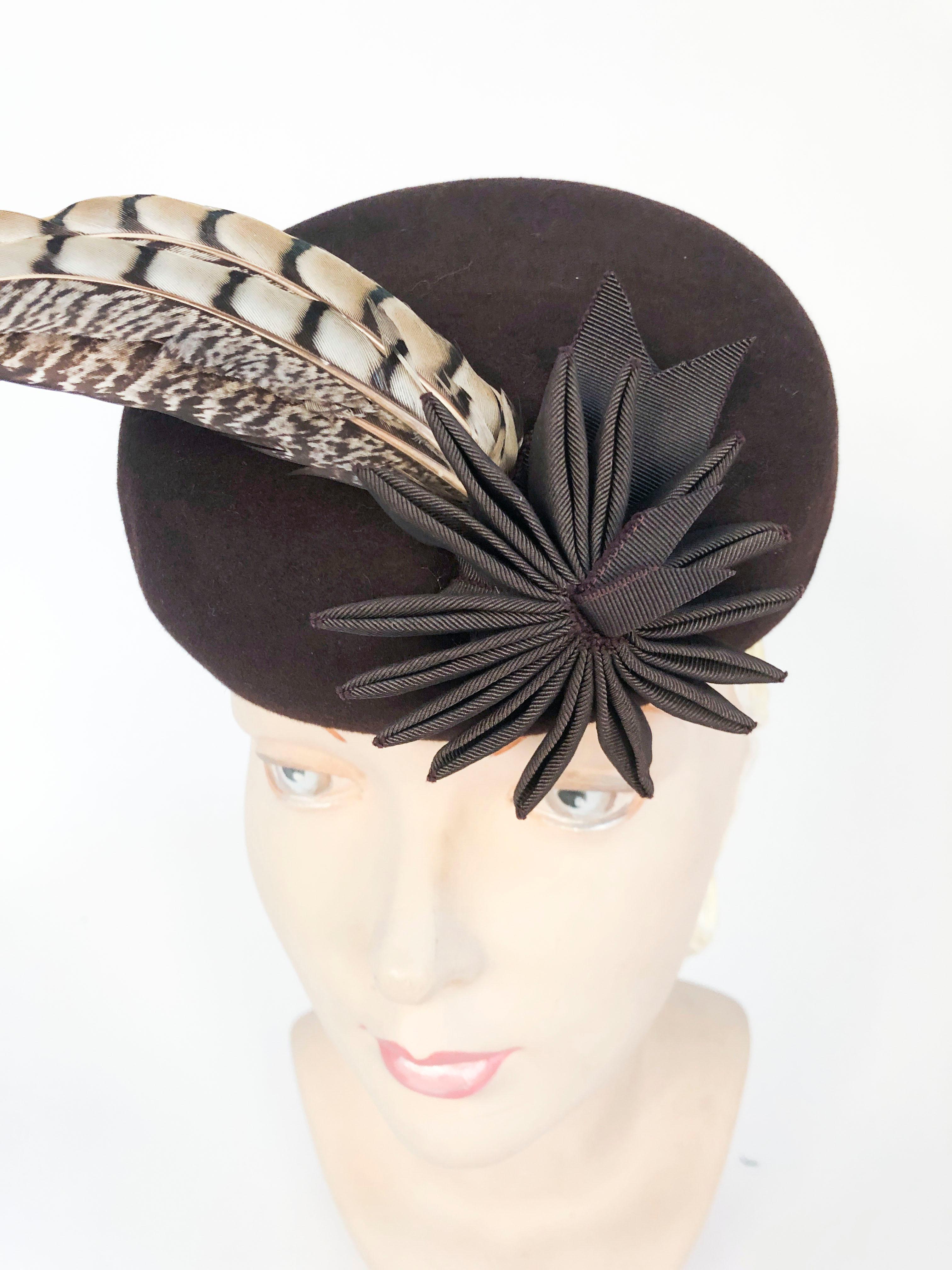 1930s/1940s Brown Fur Felt Sculpted Hat With Feather and Ribbon Accents. This hat is multi-dimensional with its grosgrain flower/tails and its 3 accent feathers.This hat has a back panel to xlant the hat and including the matching hand-made hatpin.