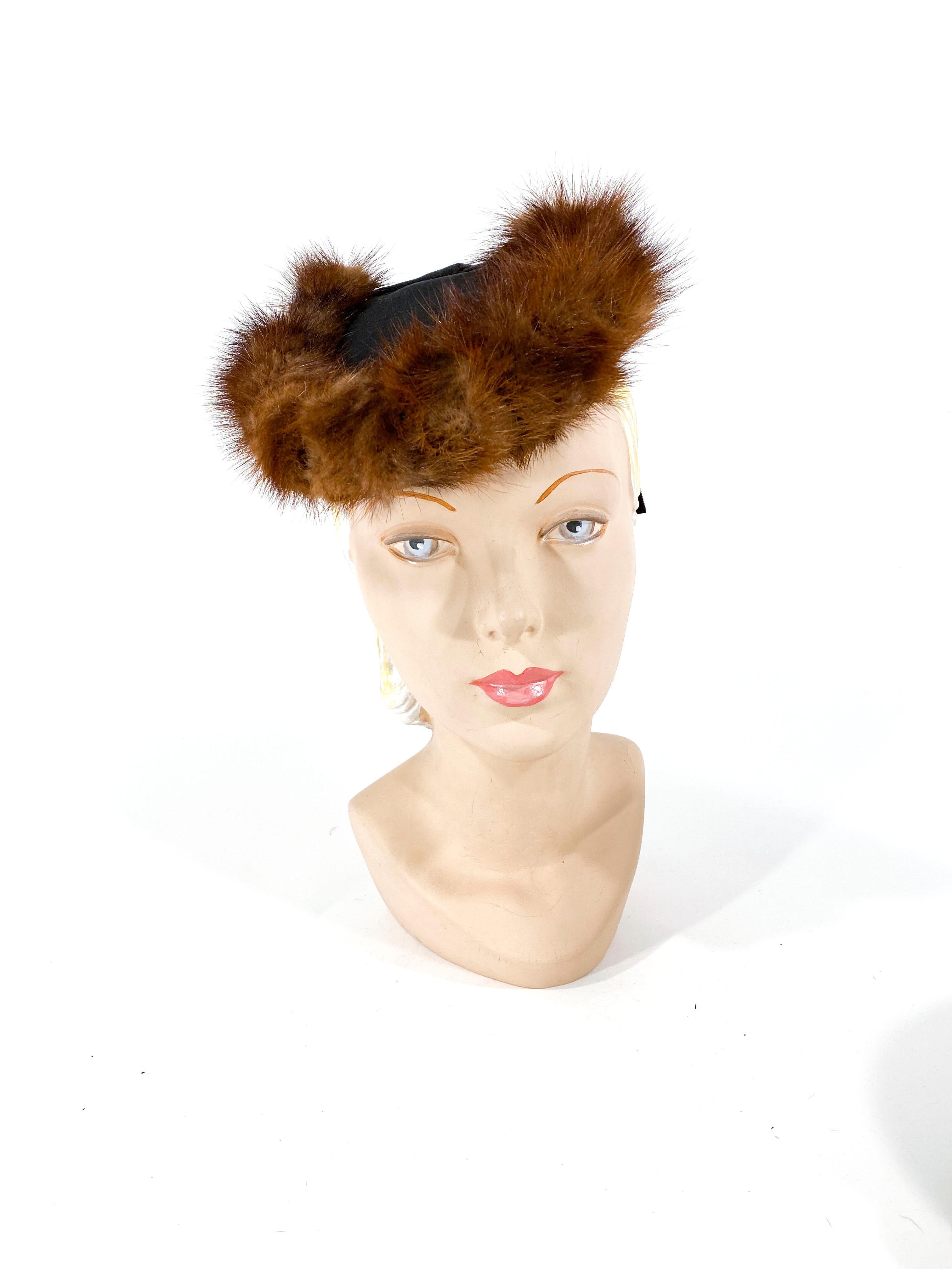 Late 1930s to early 1940s Black twill hat with brown mink trim and a wide grosgrain drape.