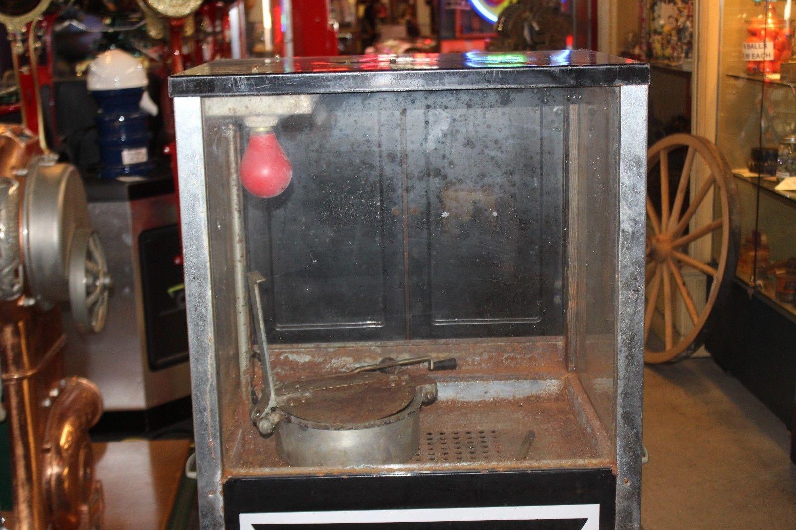 Great original piece or a perfect restoration project. Very hard to find popcorn machine with porcelain side advertising.