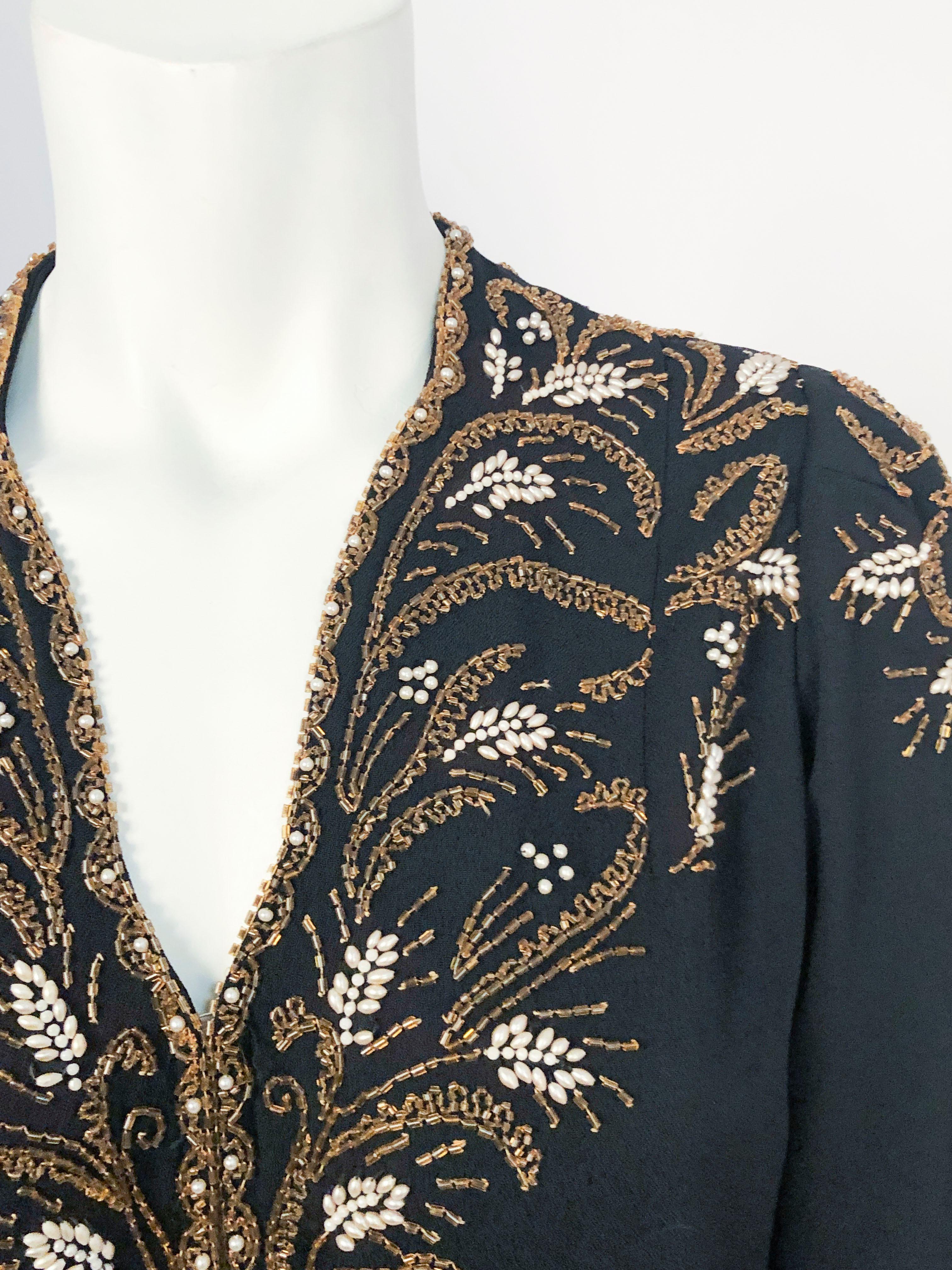 1930s/1940s Black Crepe Evening Jacket with couture style hand-beading in antique gold and pearl. Also has original zippers on wrists for aiding in putting the garment on and taking it off. Shoulder measurement is 14 1/2 inches.