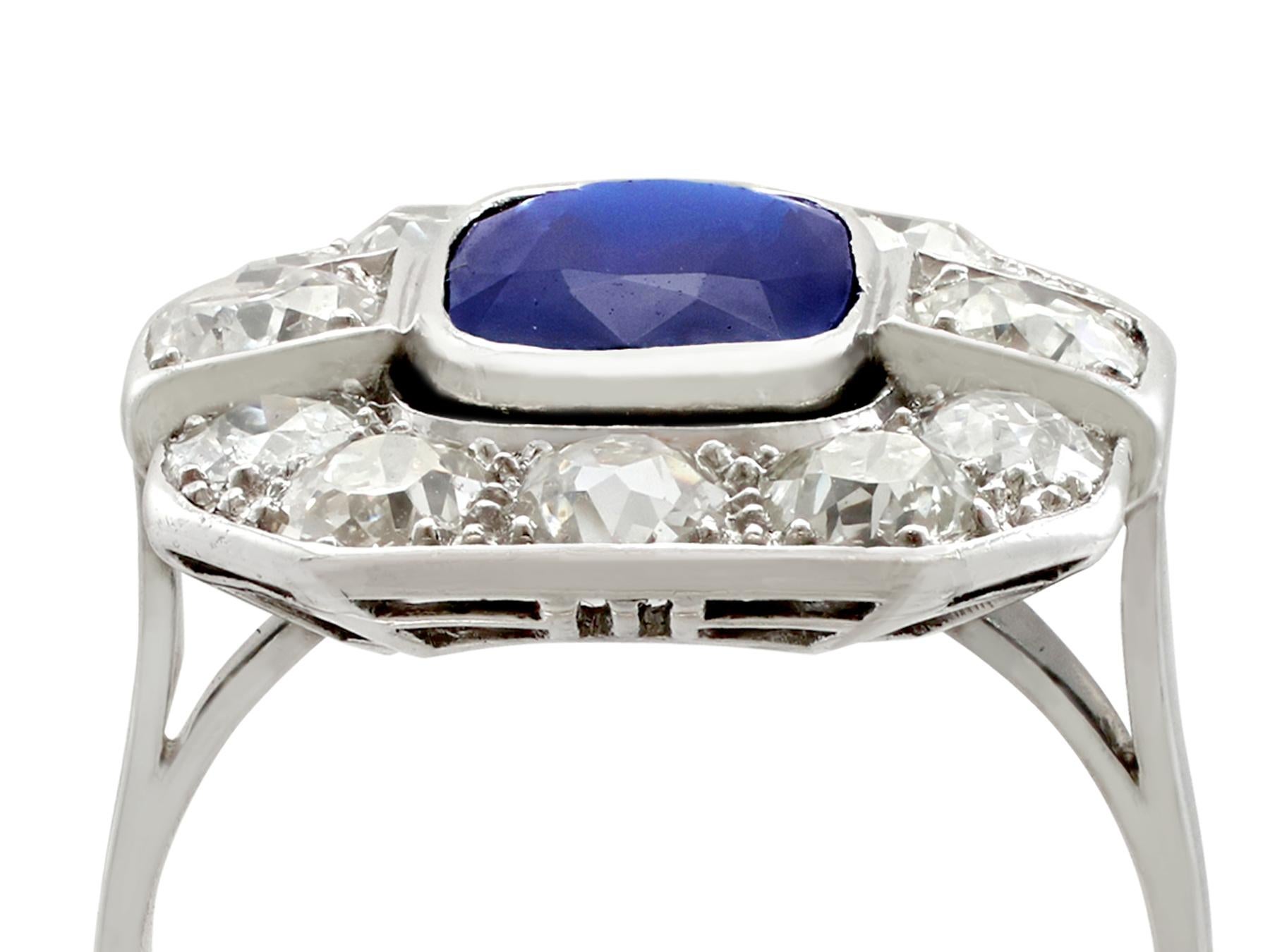 A stunning antique 2.62 carat Basaltic sapphire and 2.85 carat diamond, 18 karat white gold and platinum set cluster ring; part of our diverse antique jewelry and estate jewelry collections

This stunning, fine and impressive 1930s sapphire and