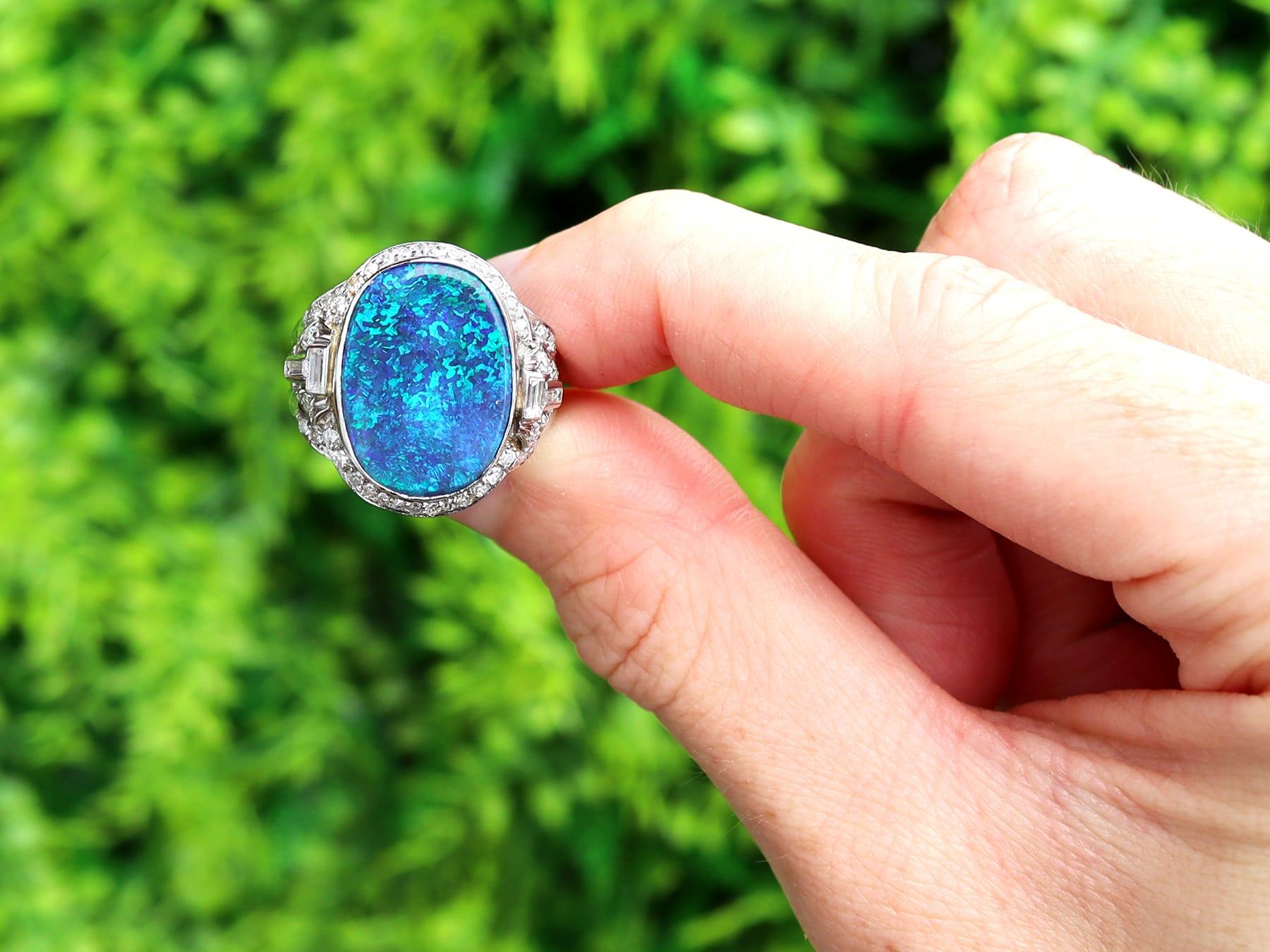 A stunning antique 1930s 3.83 Ct black opal and 1.15 Ct diamond, platinum cocktail ring; part of our diverse antique jewelry and estate jewelry collections.

This stunning, fine and impressive black opal ring with diamond has been crafted in