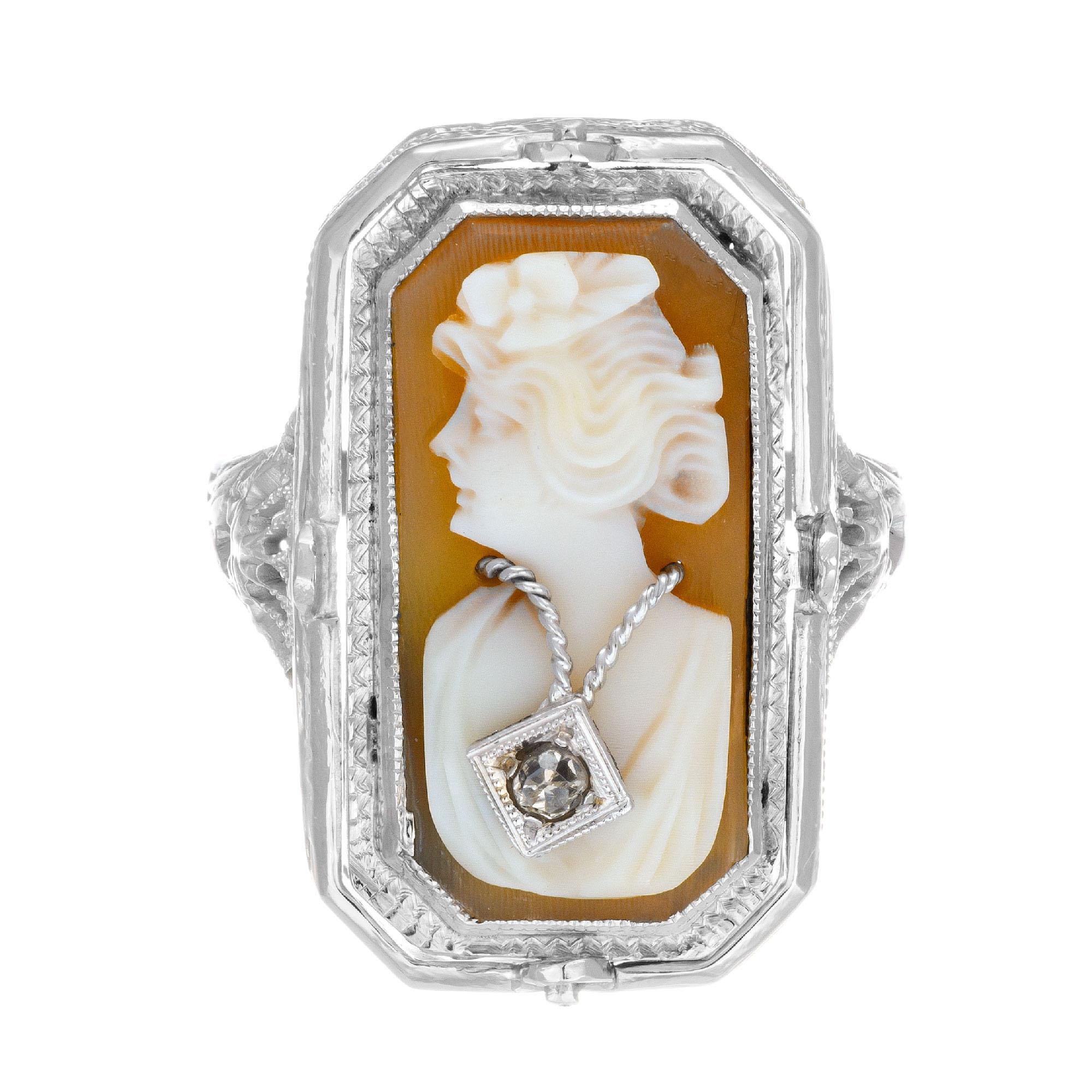 1930’s diamond, onyx and cameo flip ring. Onyx and round diamond on one side which can be flipped to show a cameo with one round accent diamond. 14k white gold filigree flip ring.

2 single cut diamonds, I SI approx. .4cts
Size 6.5 and sizable
1