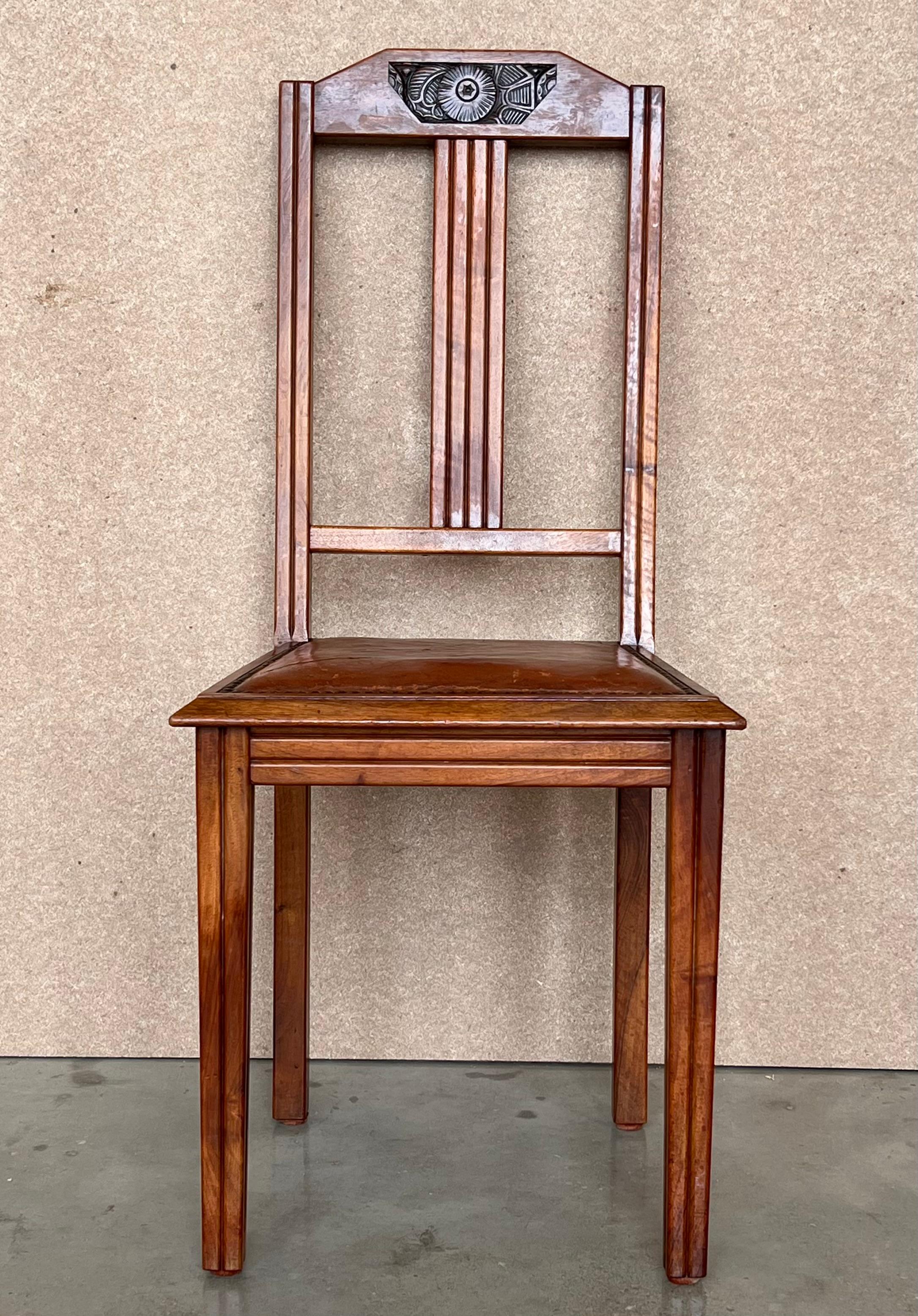 A magnificent set of six Modernist Art Deco dining chairs in style of Charles Dudouyt in original period burgundy Rexine . Carved oak detailing to the back and elegant modernist sabre-shape to the front legs. The seats are sprung for comfort, and