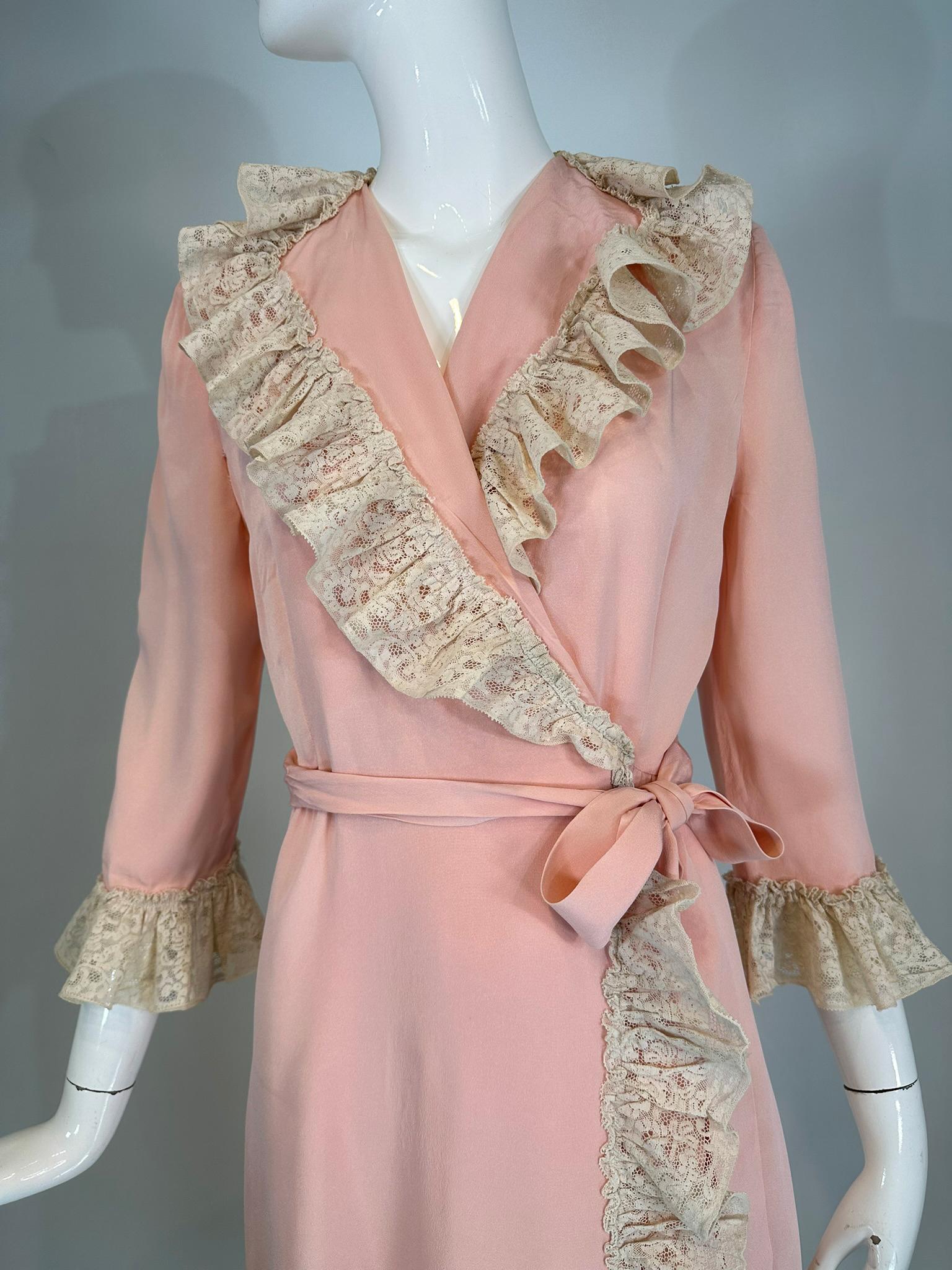 1930s-40s pink rayon with cream lace wrap & tie robe. A beautiful robe reminiscent of robes worn in Hollywood movies from the late 1930s thru the early 1940s. Silky pink rayon is trimmed with a deep ruffle of ivory cream lace. The robe has a deep