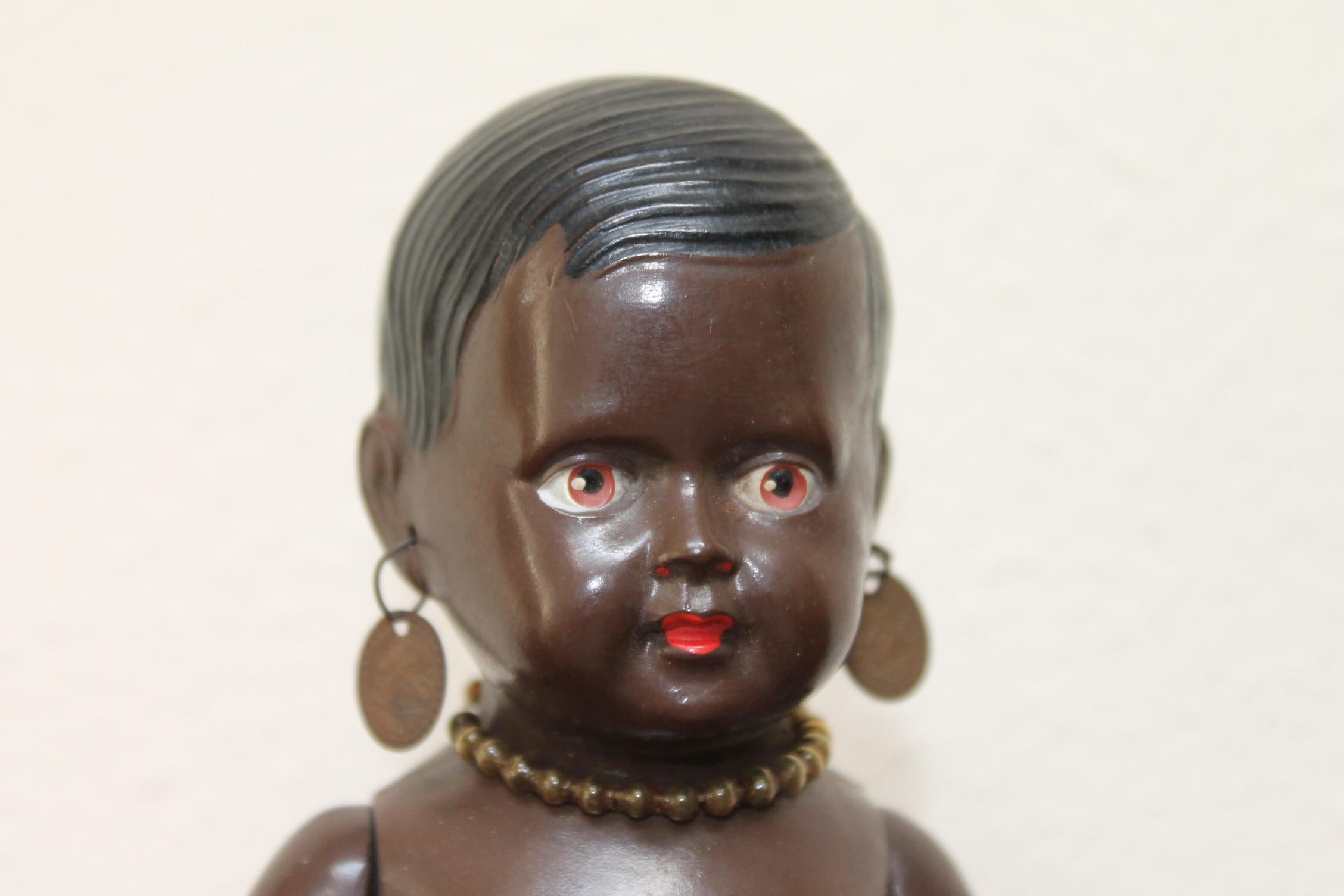Cellba black sitting doll, Afro-American Celluloid doll -Cellba dolls Germany.
1930s Cellulloid - tortoise toy doll with movable arms and legs
Marked: DRP Germany 18 1/2
She has red lips, red lipstick, original earrings, original necklace and
