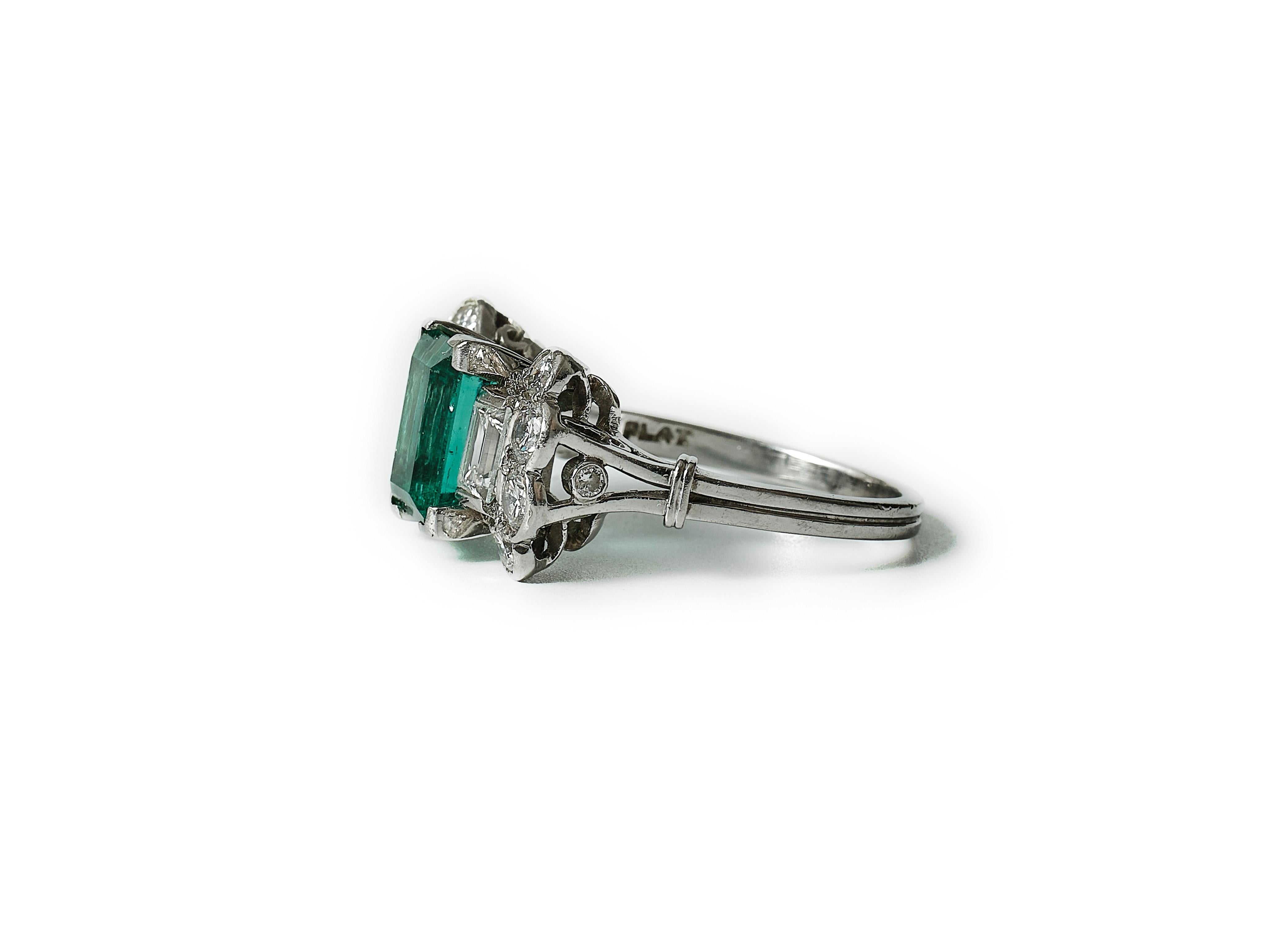 Emerald Cut 1930s American 2 ct. emerald and diamond platinum Art Déco ring. For Sale