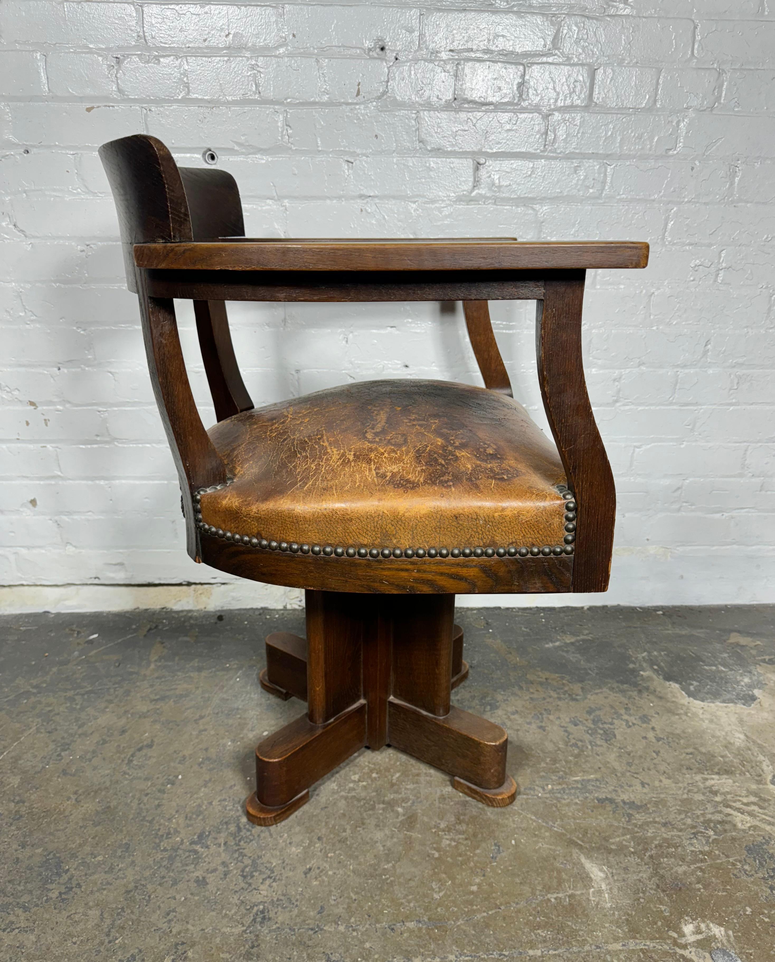1930's American / Industrial Art Deco Oak and Leather swivel desk chair / bASE VERY  Frank Lloyd Wright  inspired , Sold oak frame and base,, wonderful, perfectly worn (patinaed) leather.. Extremely comfortable. Arm height 27.5