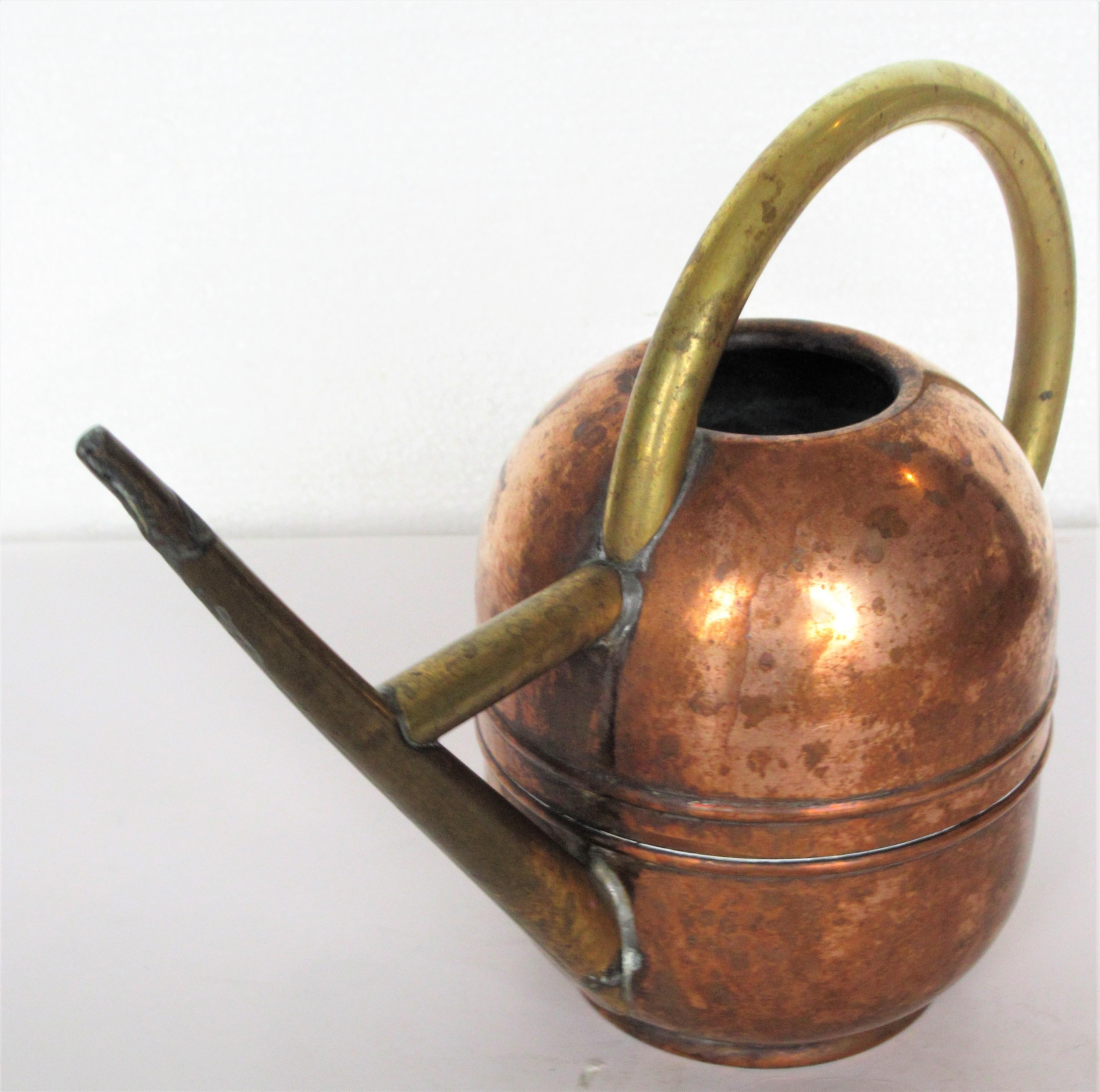  American Art Deco machine age copper and brass watering can designed by Walter Von Nessen for Chase. Stamped Chase with centaur figure on underside, circa 1930. Look at all pictures and read condition report in comment section.